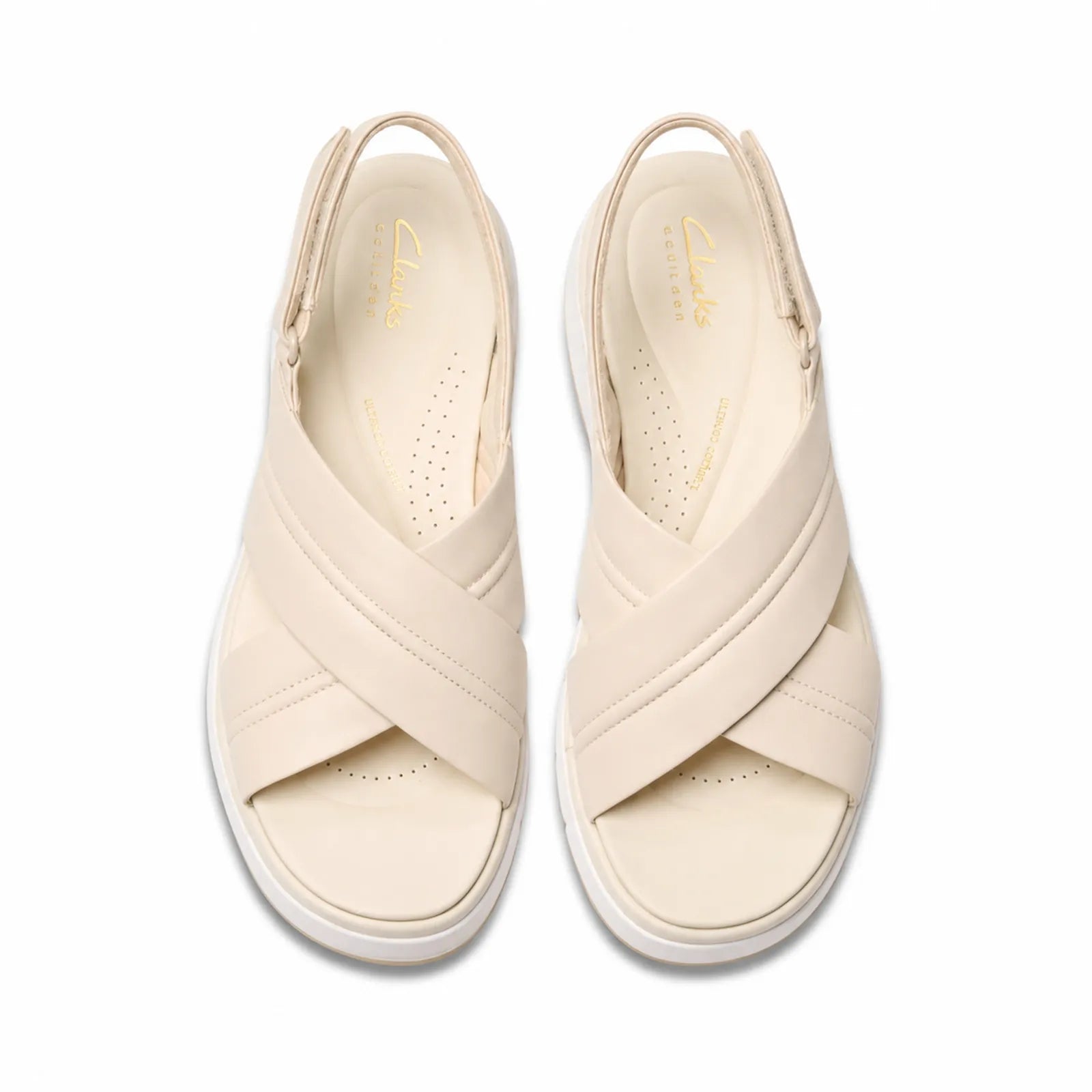 Pair of cream white leather open-toe platform sandals with cross-over straps