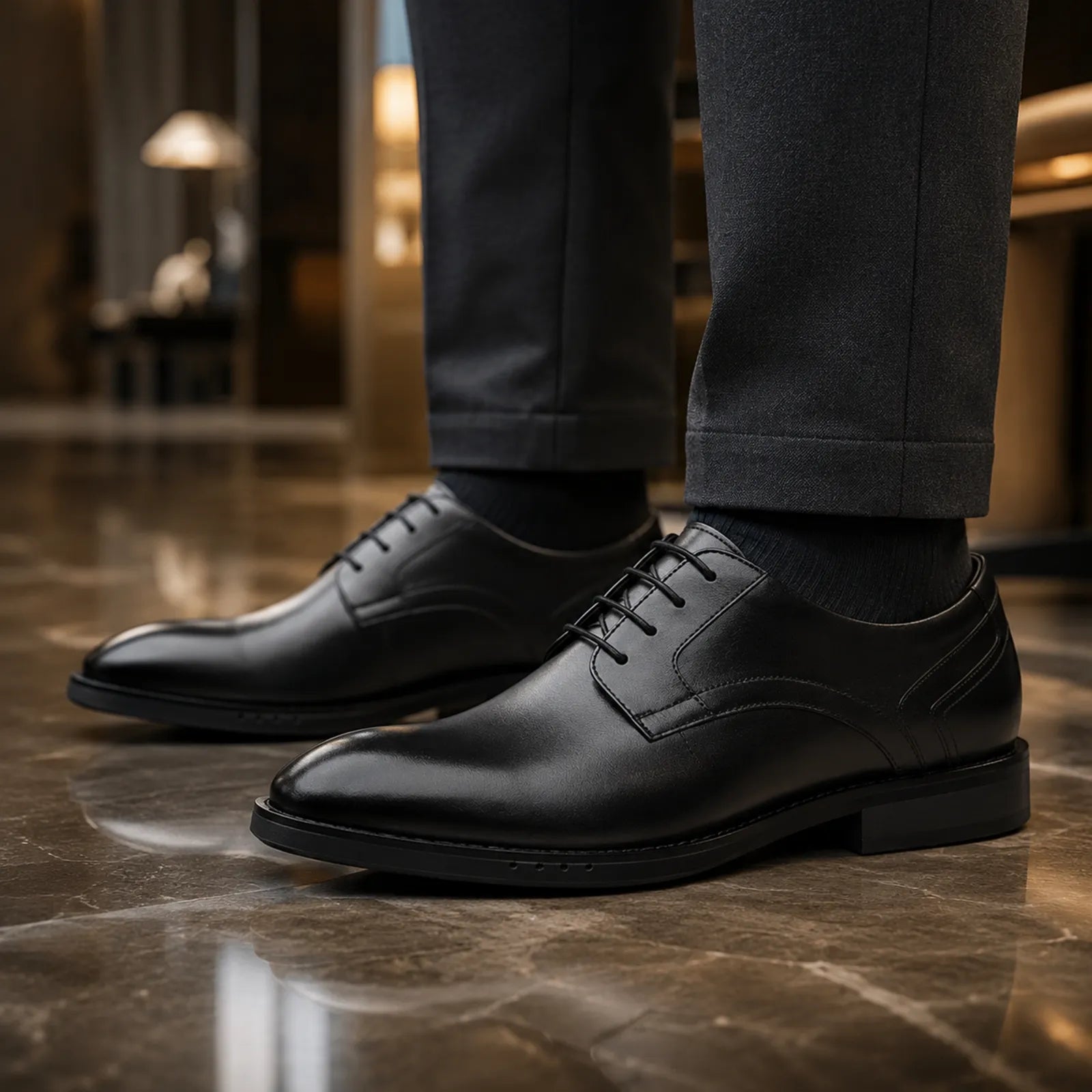Black leather lace-up oxford shoe with smooth toe and low-profile sole