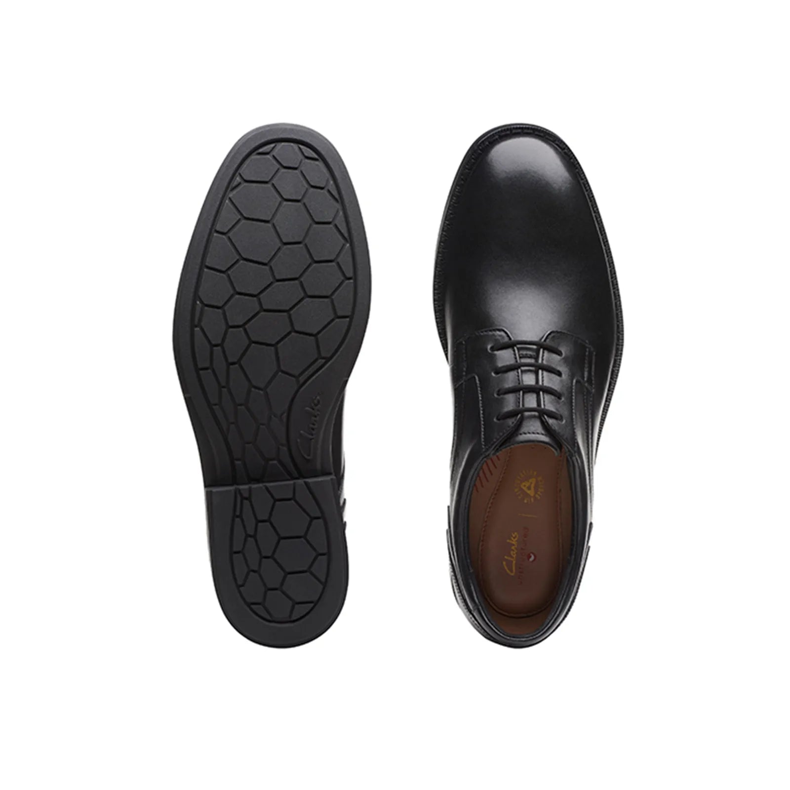 Black dress shoe outsole and heel view with hex-pattern rubber and lace upper