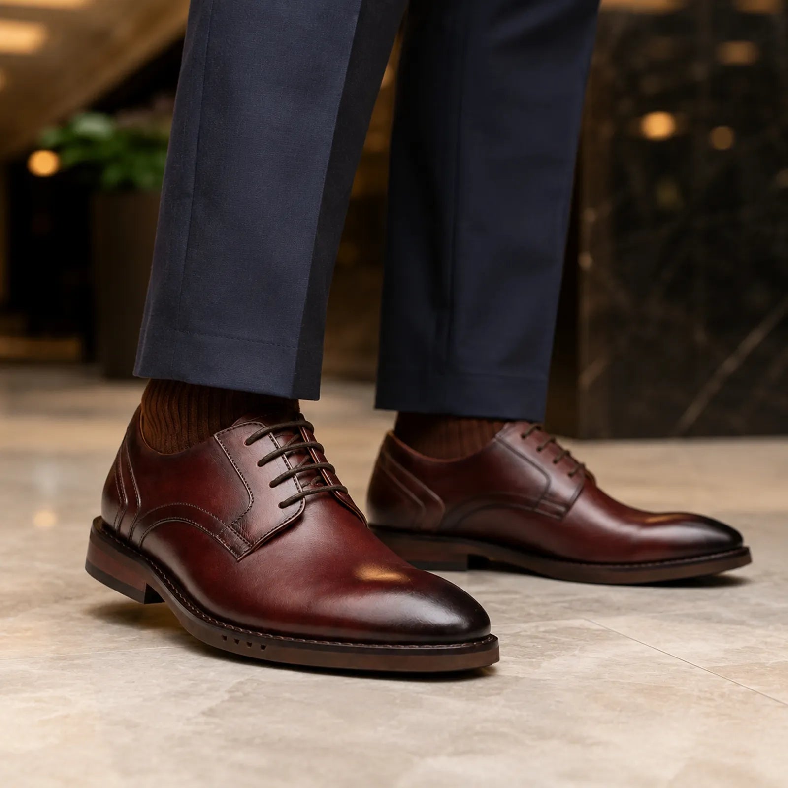 Brown leather lace-up oxford shoe with stacked sole and dark lace-up front