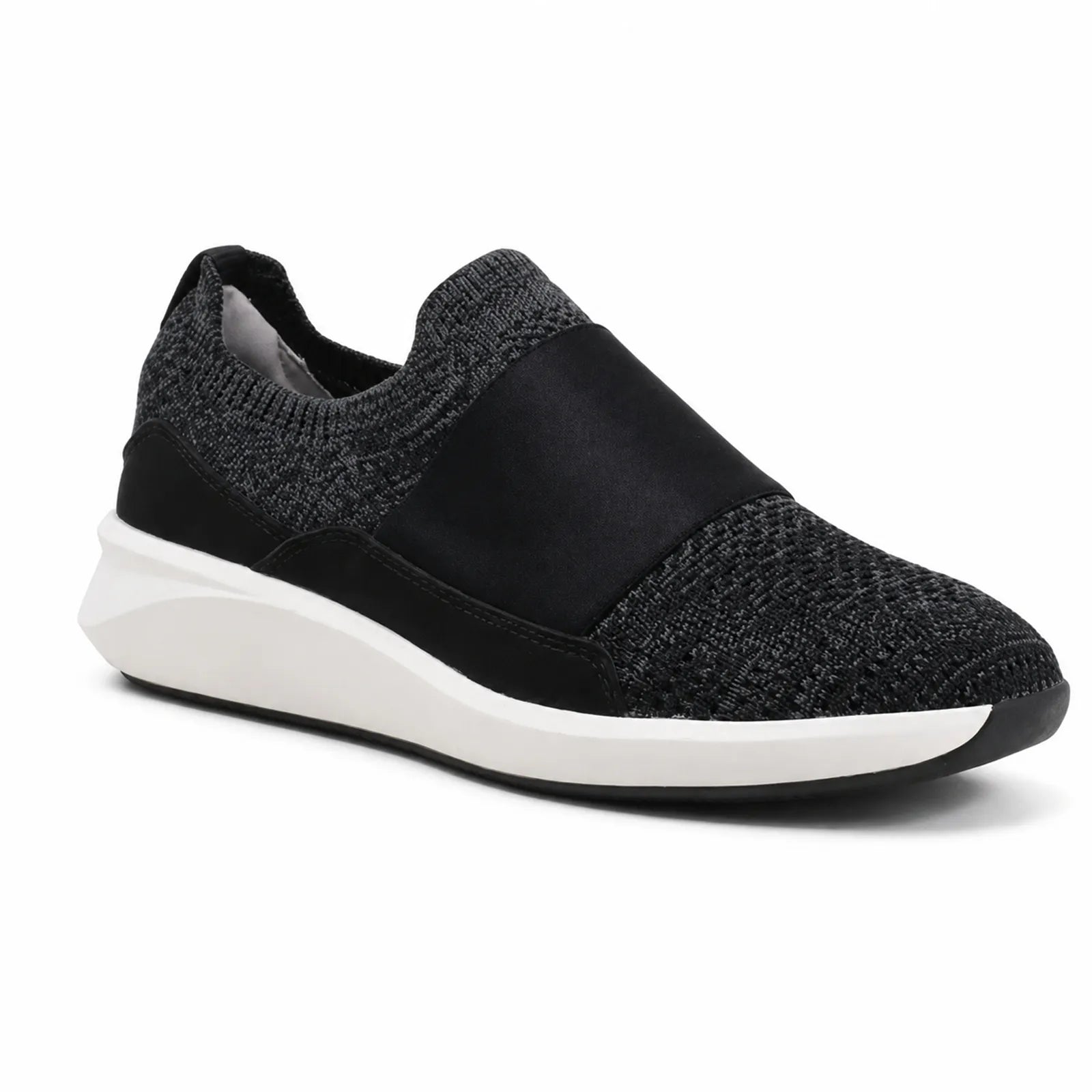 Women’s black knit slip-on sneakers with elastic side gore and white rubber sole.