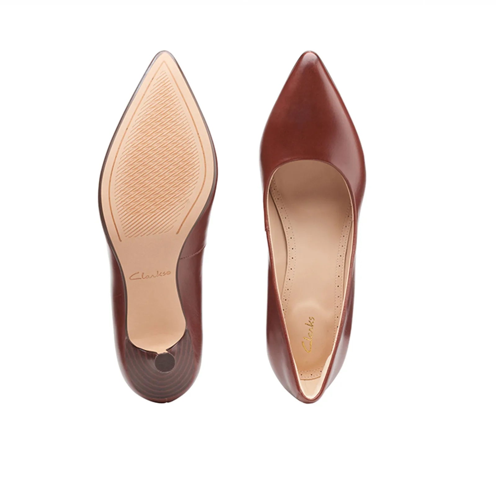 Pair of women's brown pointed-toe slip-on heels with beige lining and slim heel