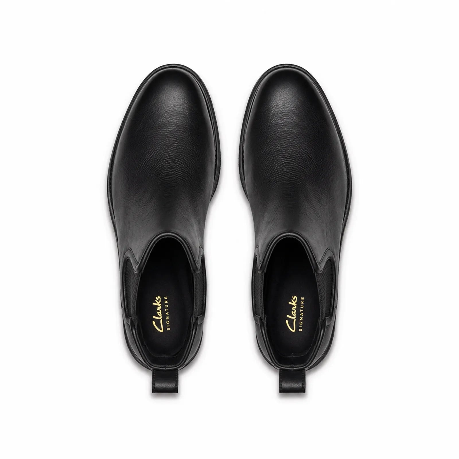 Pair of black leather chelsea ankle boots with elastic gore and cushioned footbed
