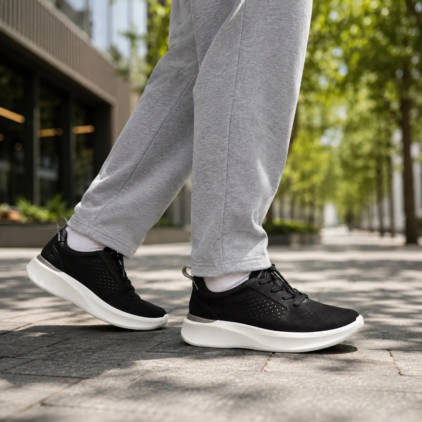 Men's black lace-up sneakers with textured upper and white sole