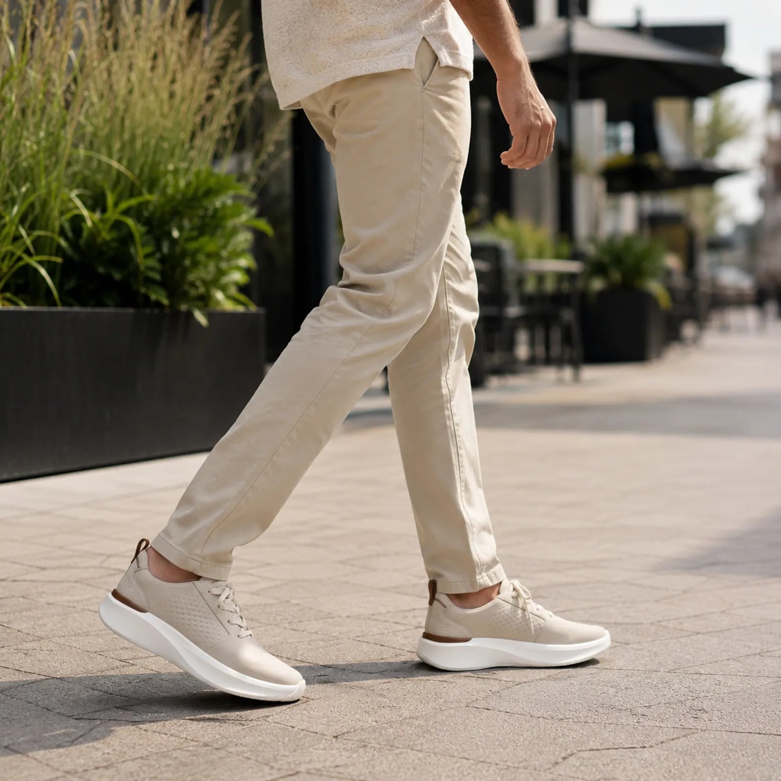 Men's off-white lace-up sneakers with textured upper and white outsole