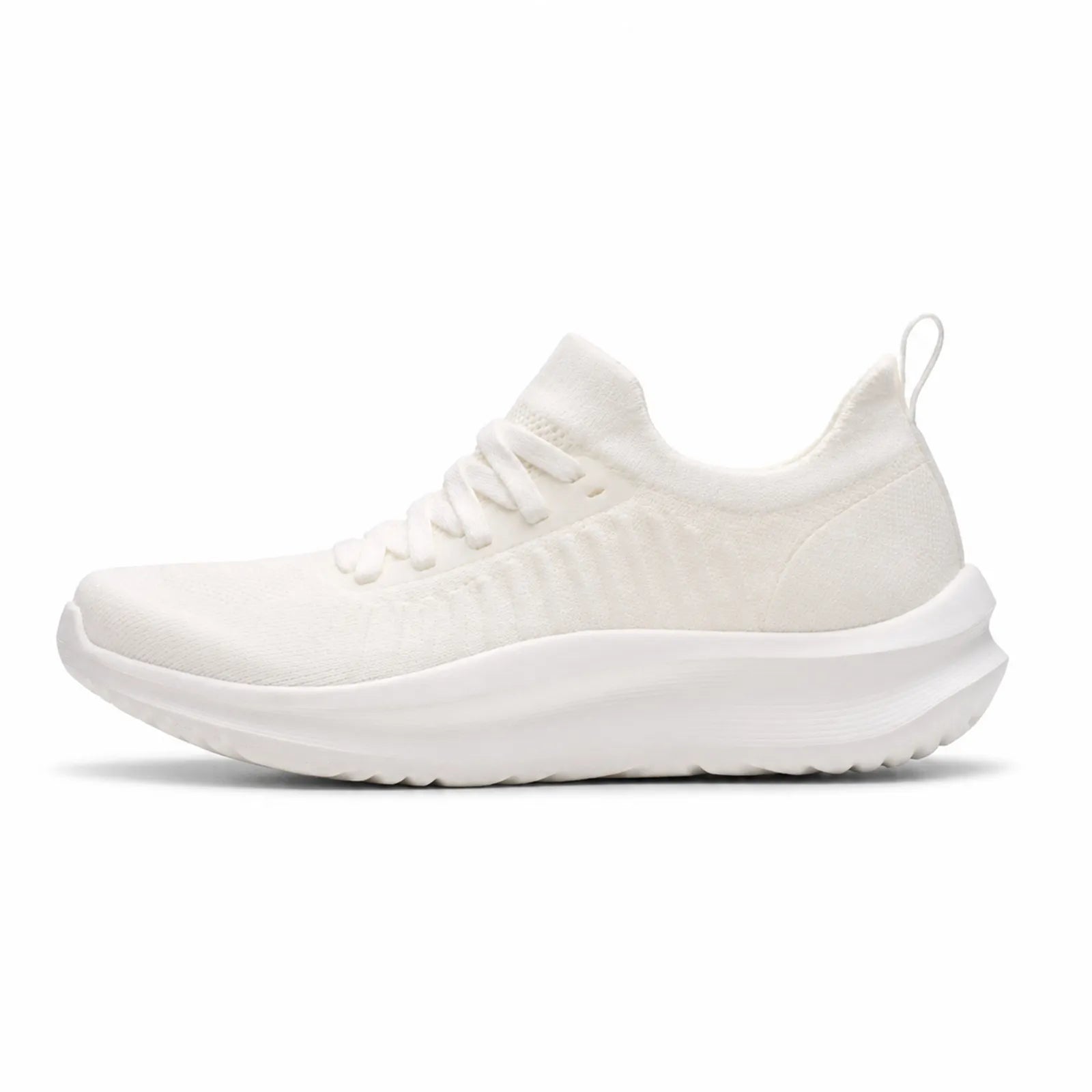 White lace-up knit sneakers with thick cushioned sole, side view