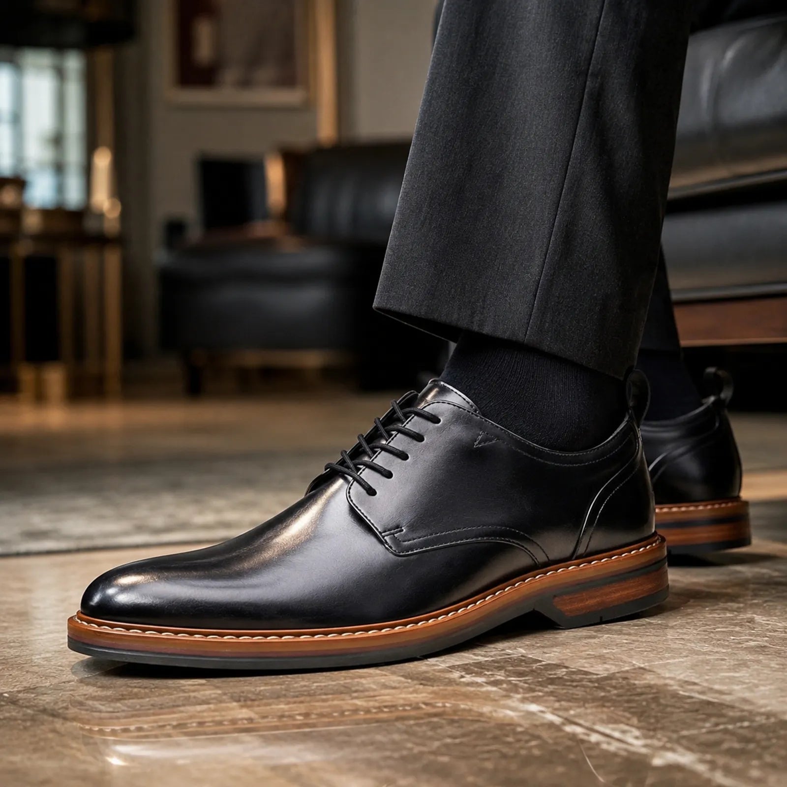 Black leather lace-up formal shoe with stitched panel and brown rubber sole edge