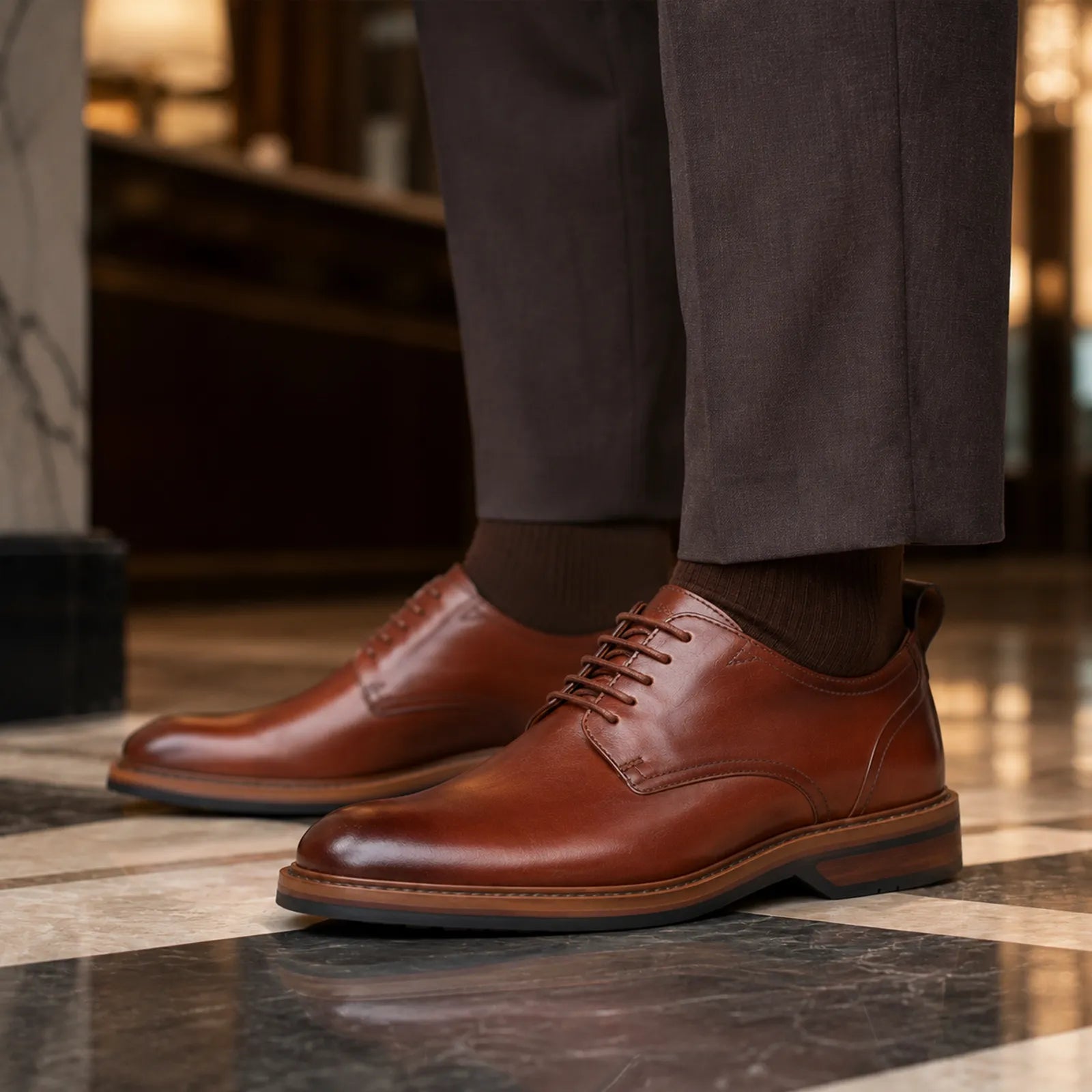 Brown leather lace-up formal shoe with stitched upper and light-brown welt