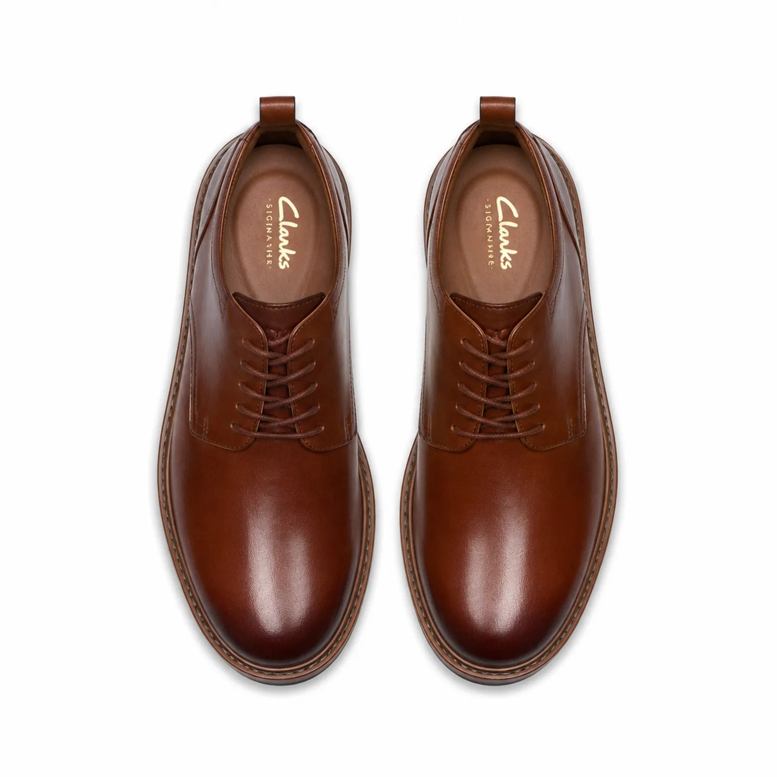 Pair of brown leather lace-up dress shoes with cushioned collar and rubber sole