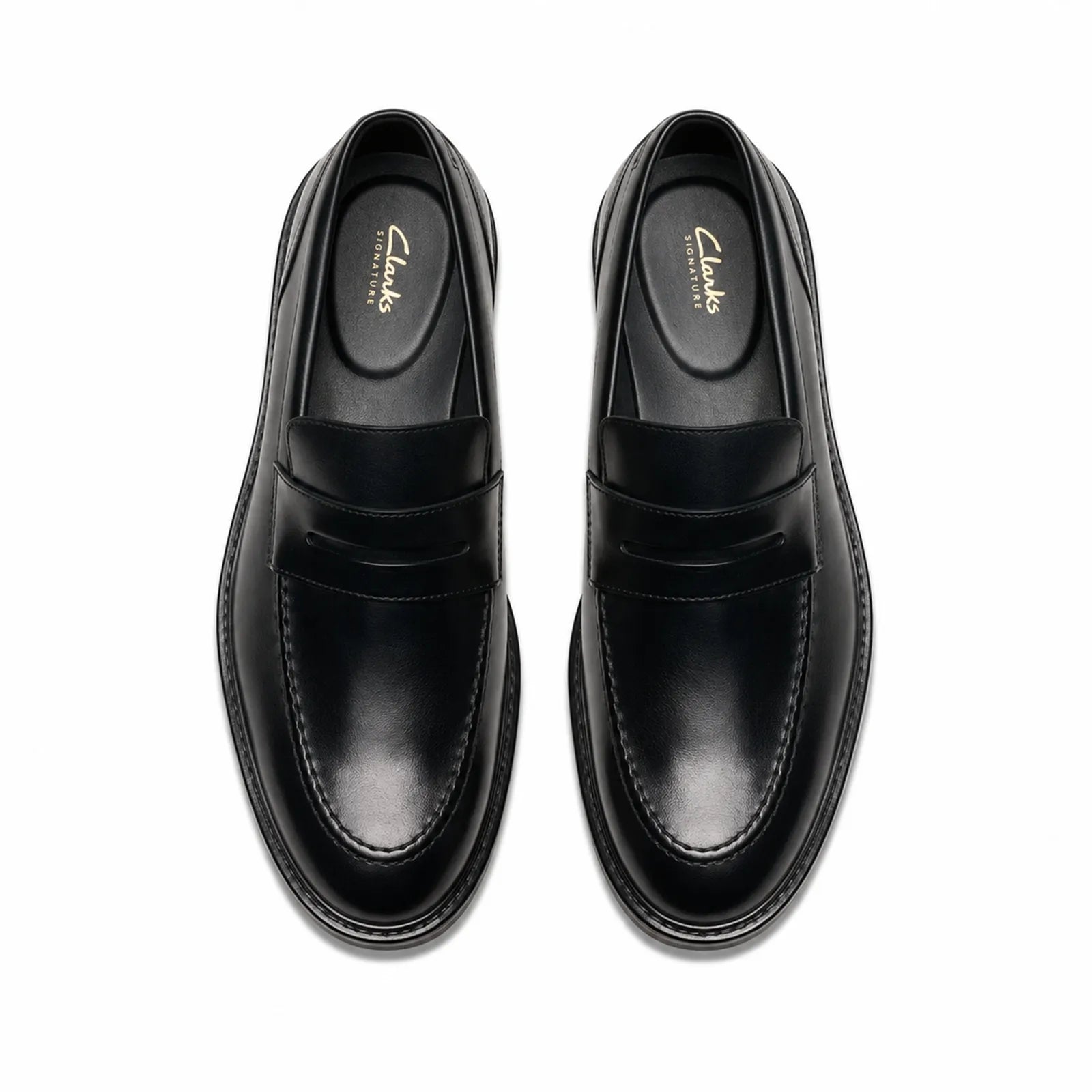 Pair of black leather men’s loafers with strap detail and contrast stitching