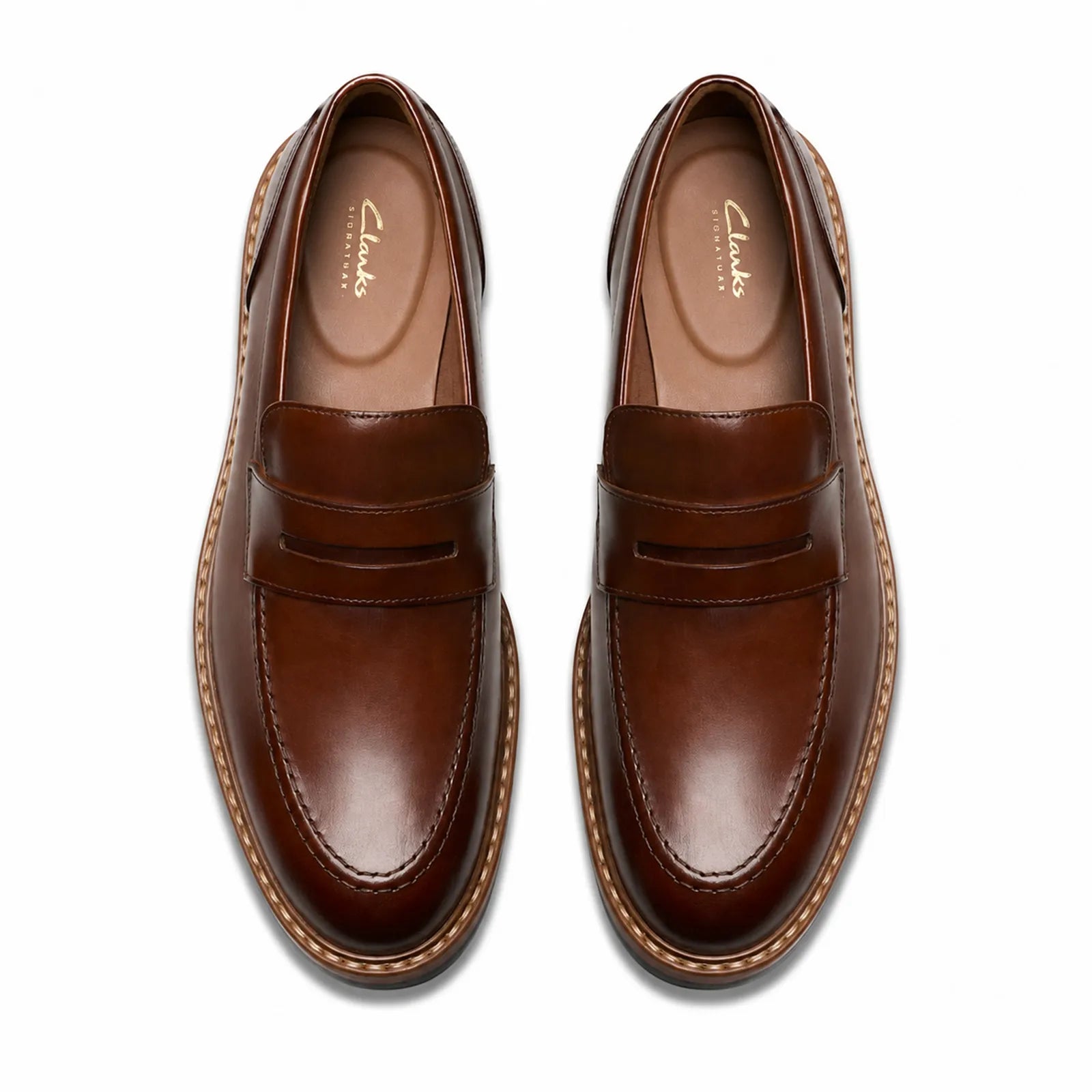 Pair of brown leather men’s loafers with strap detail and contrast stitching