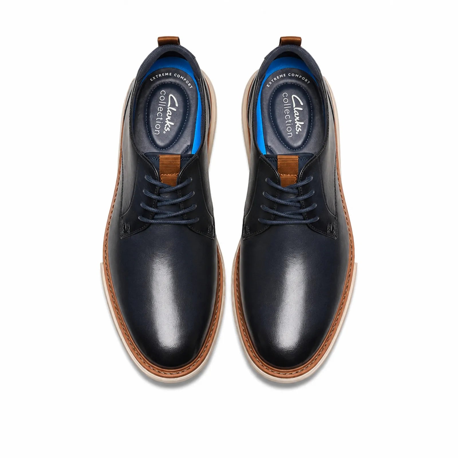 Pair of men's lace-up leather shoes, dark blue uppers with tan edge sole