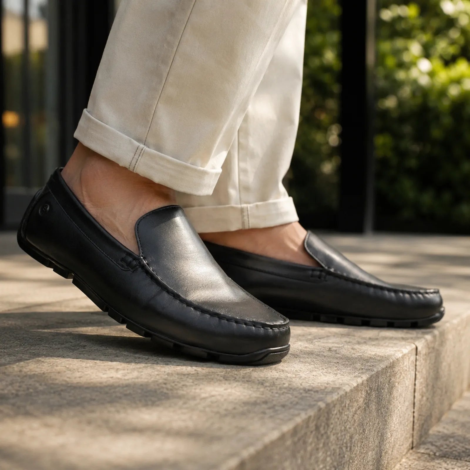 Clarks Corsley Plain black leather loafers shown on foot for smart casual everyday wear