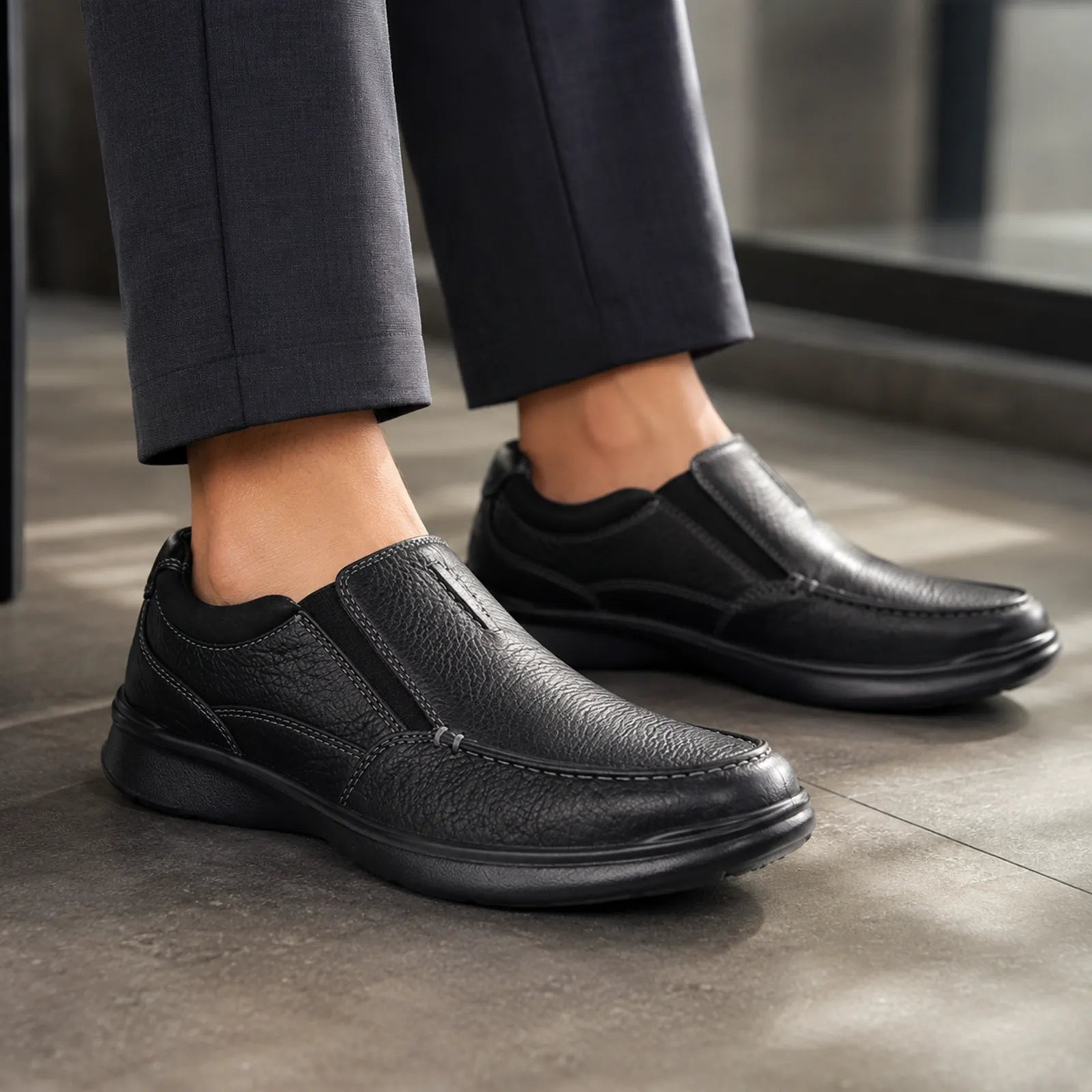 Men's black leather slip-on shoes with side goring and rounded toe