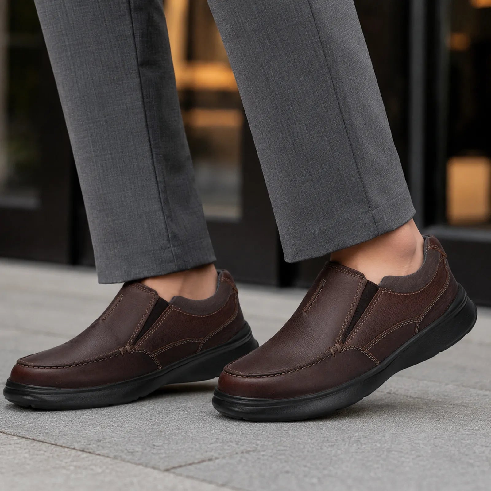 Men's brown leather slip-on shoes with side goring and rounded toe