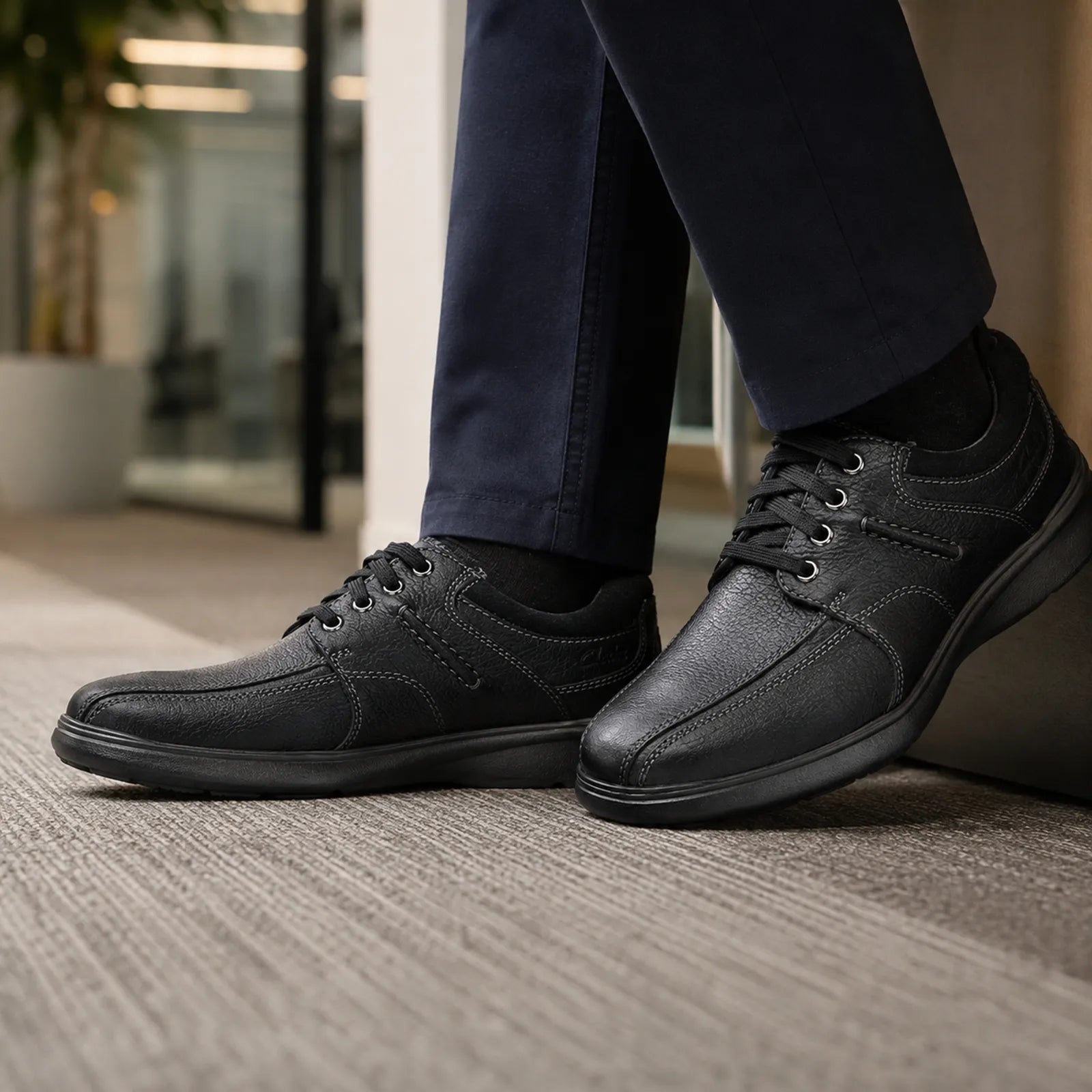 Men's black leather lace-up dress walking shoes, side view with rubber tread sole