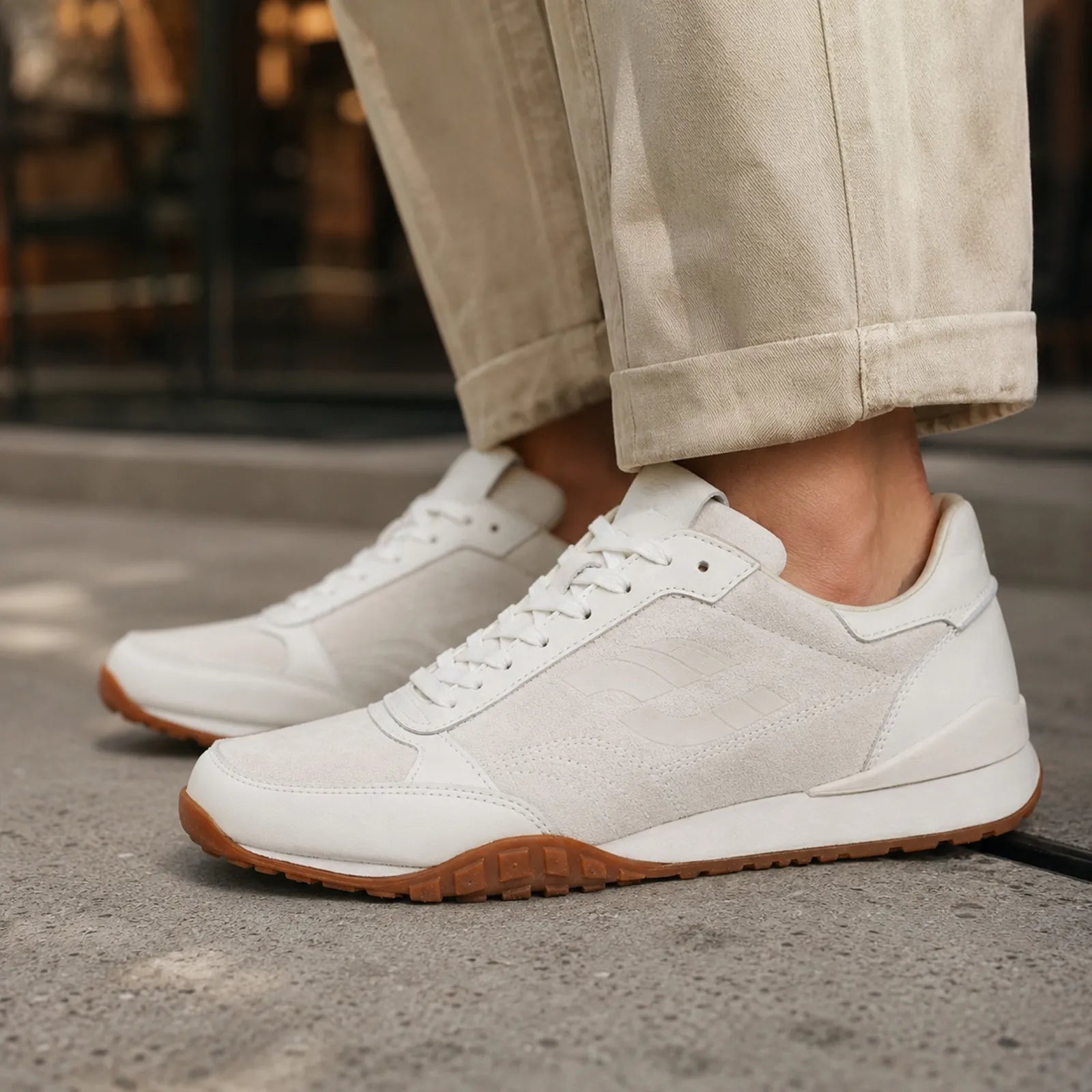 Men's white lace-up sneakers with gum-brown outsole and thick sole edge
