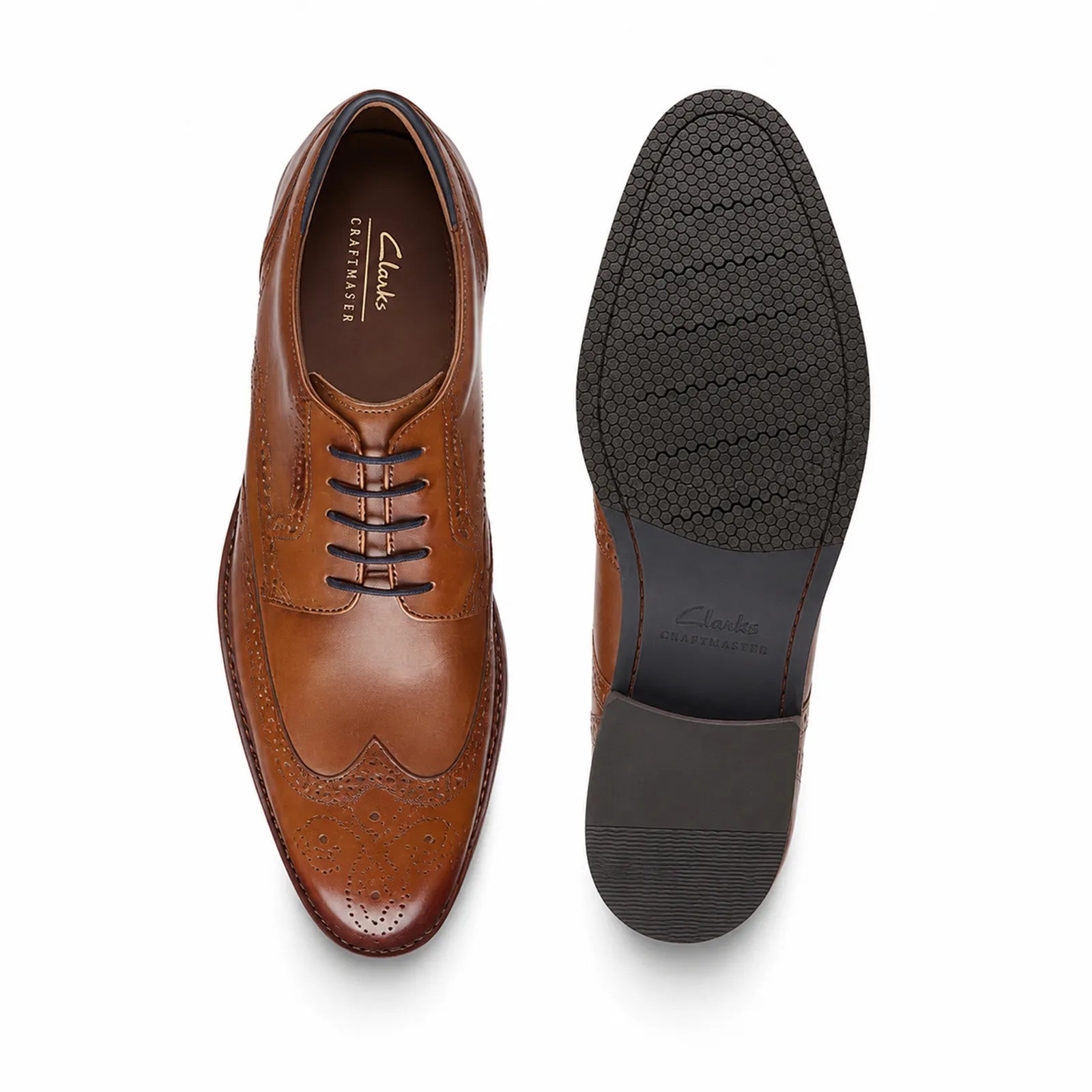 Men's brown leather lace-up shoe front and outsole view with brogue cap-toe styling.