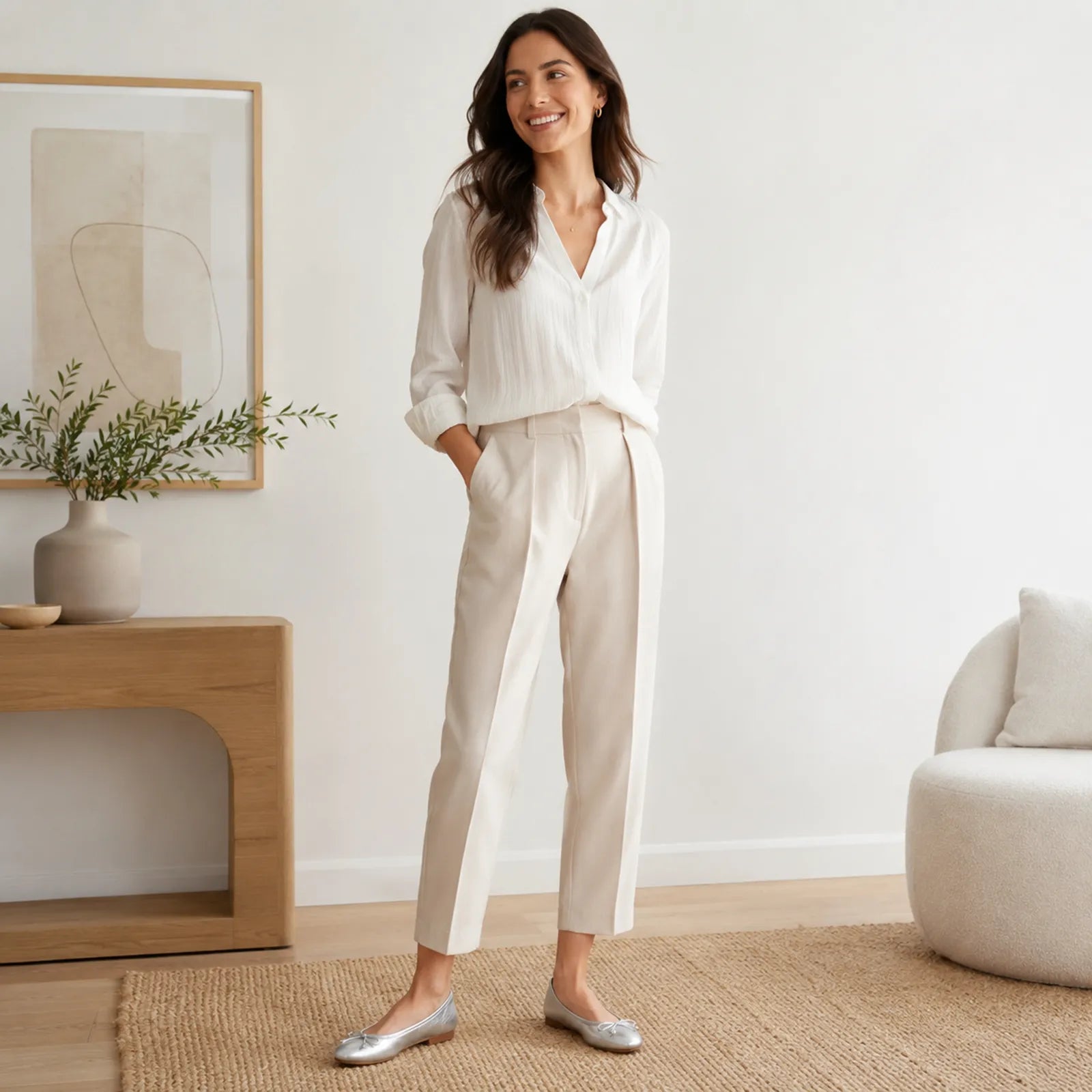 Women’s silver leather loafers with bow detail, worn with light pants