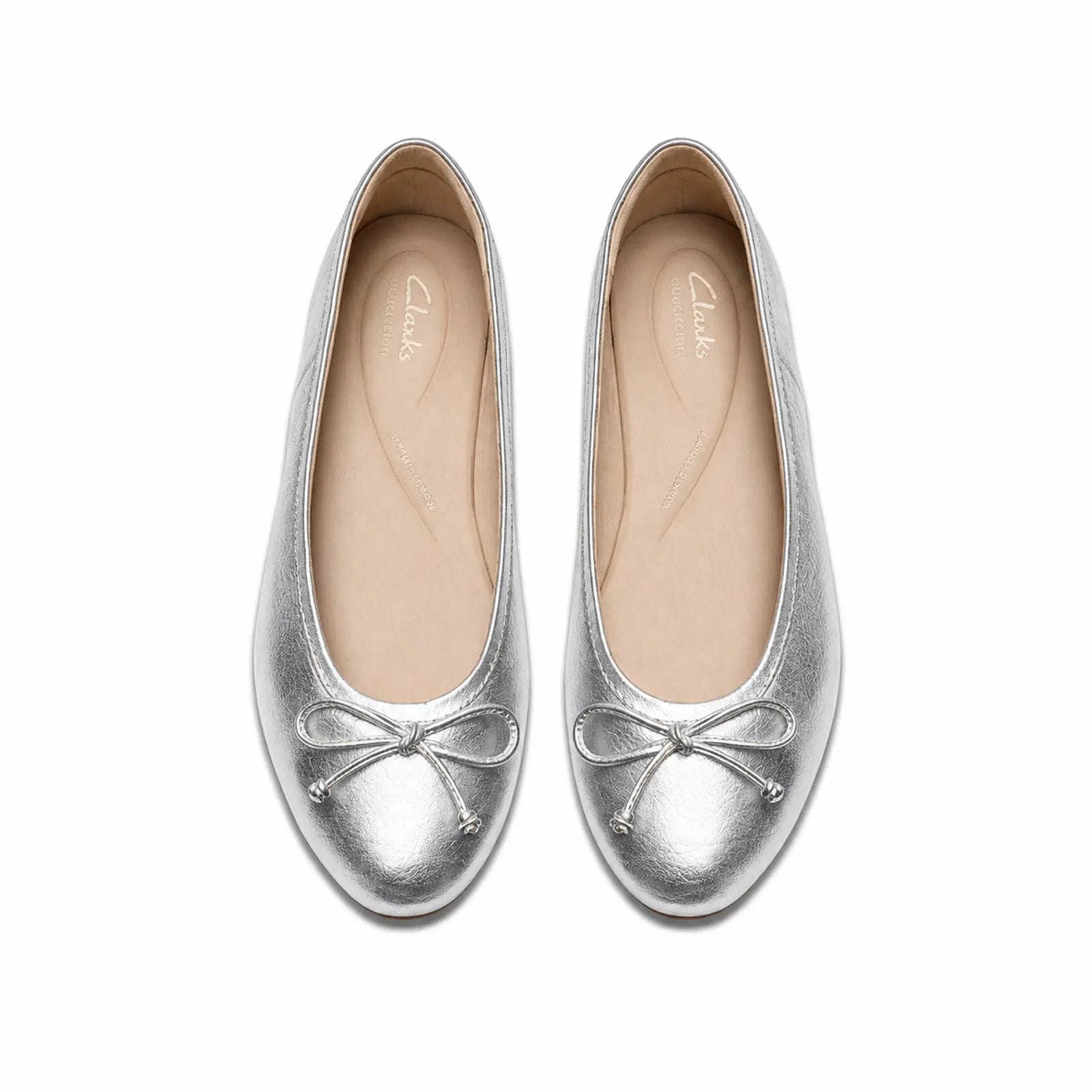 Pair of women’s silver leather loafers with bow detail and rounded toe