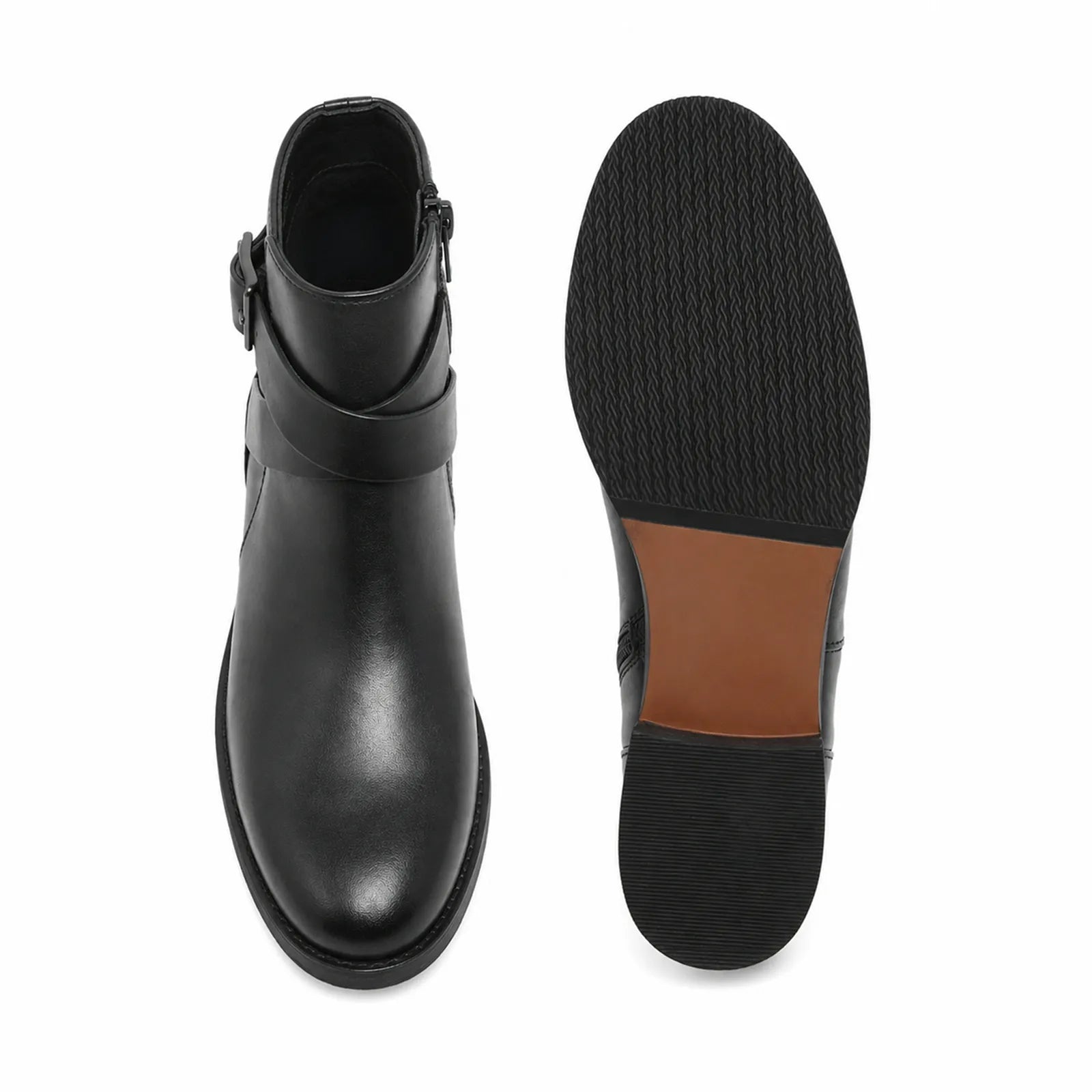 Pair of women’s leather ankle boots, black, buckle strap and textured rubber sole