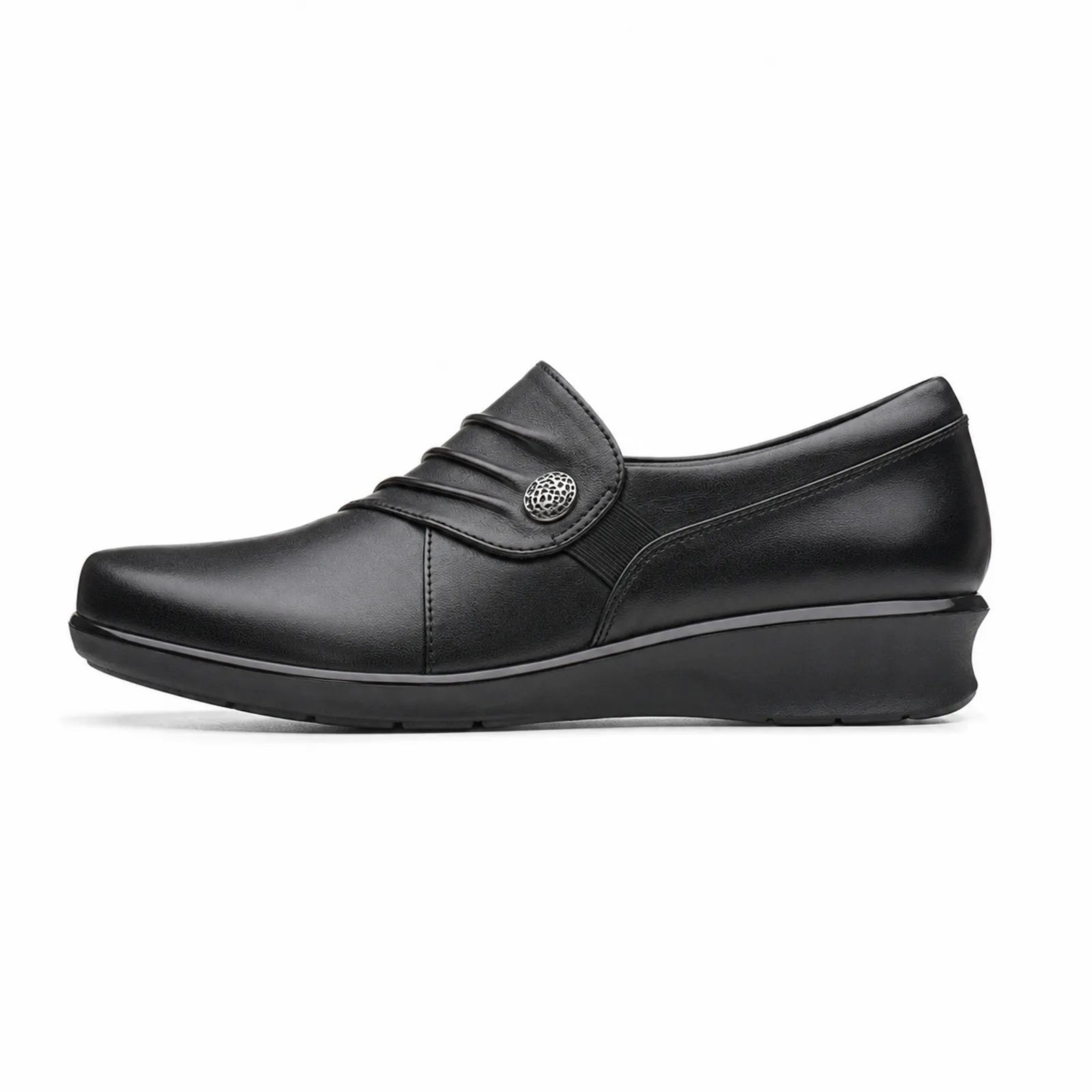 Black leather women's slip-on loafer with round button detail and wedge sole