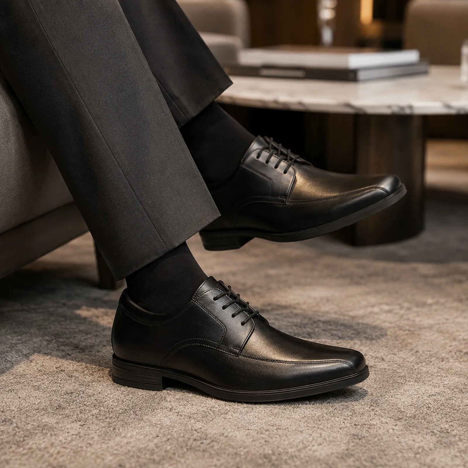 Men's black leather lace-up dress shoes with classic stitching detail