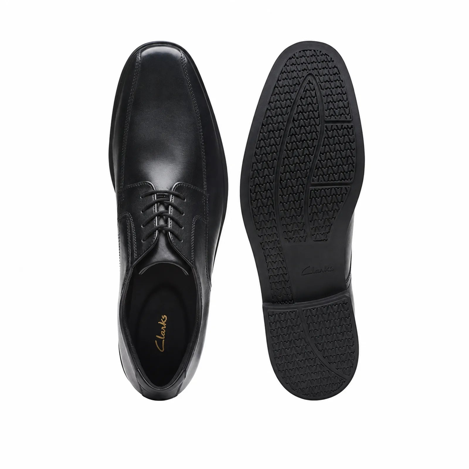Pair of men's black leather lace-up dress shoes, front and sole views
