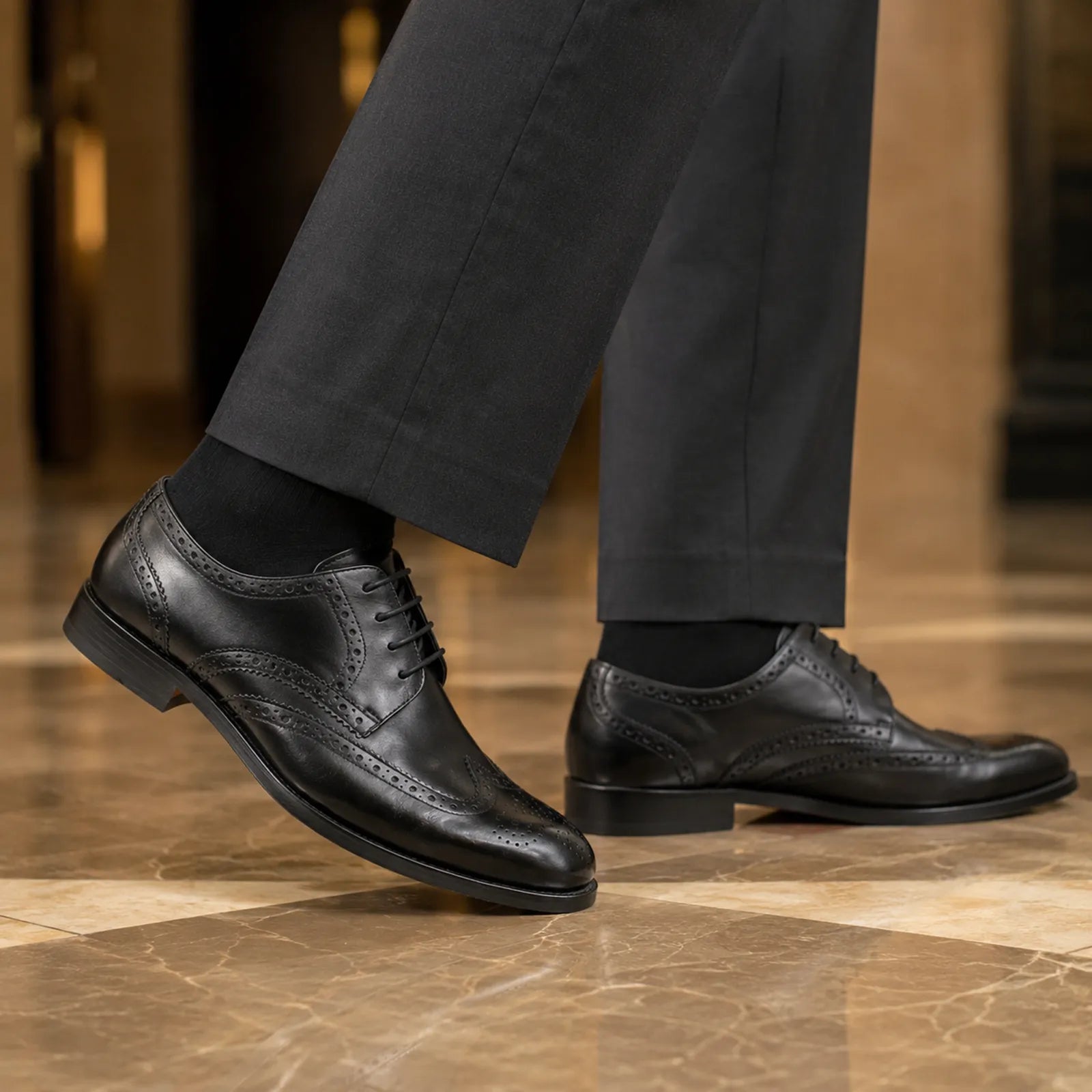Black leather lace-up wingtip brogue Oxford shoes with trouser cuffs