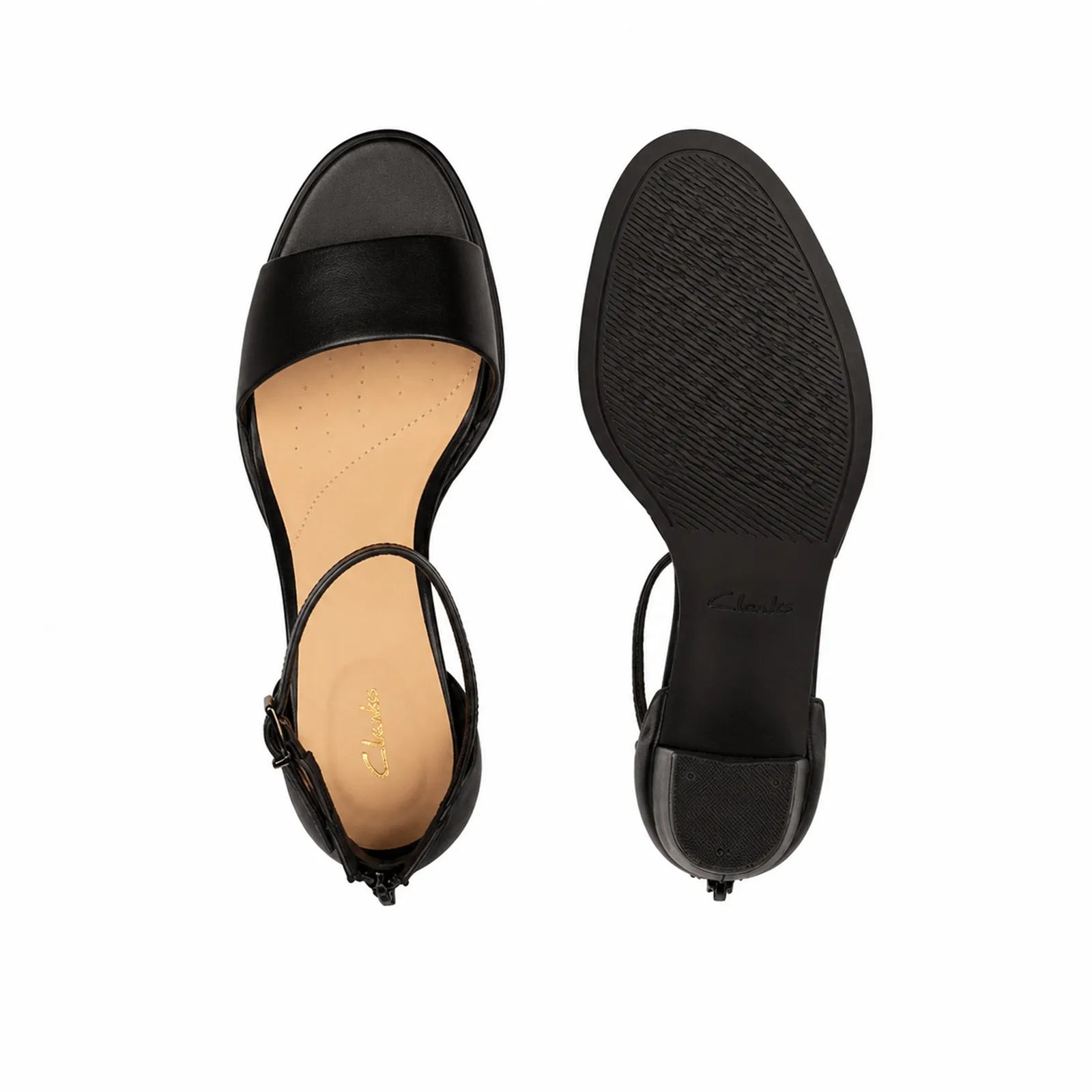 Pair of black leather ankle-strap sandals with open toe and block heel, soles