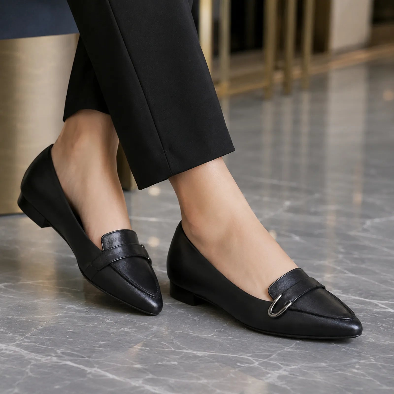 Women's black leather loafer with metal buckle and low block heel
