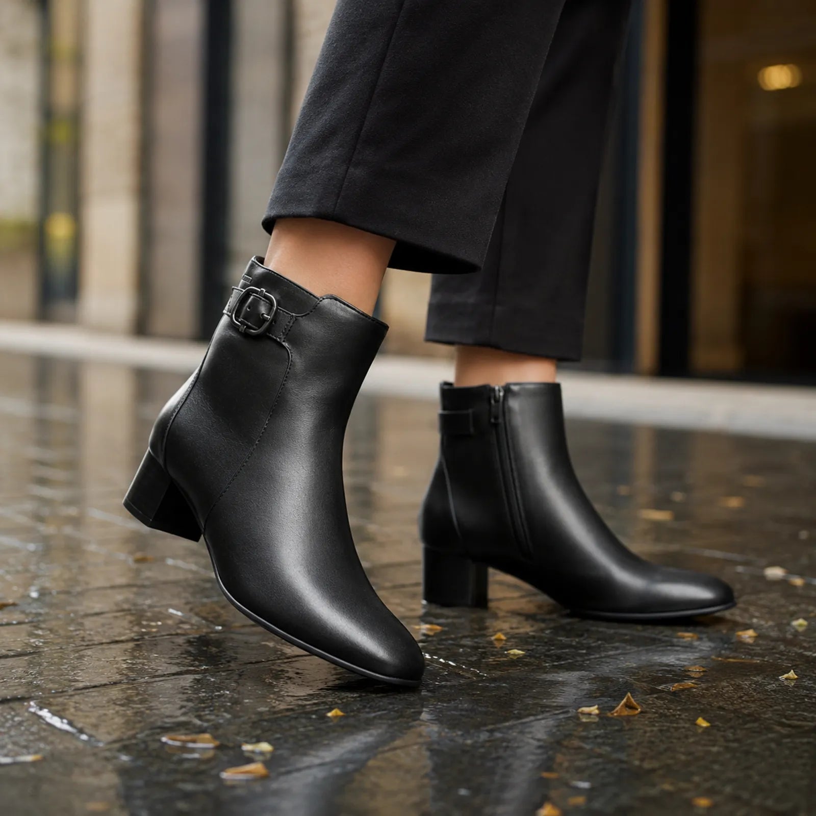 Black leather women’s ankle boots with buckle strap and block heel