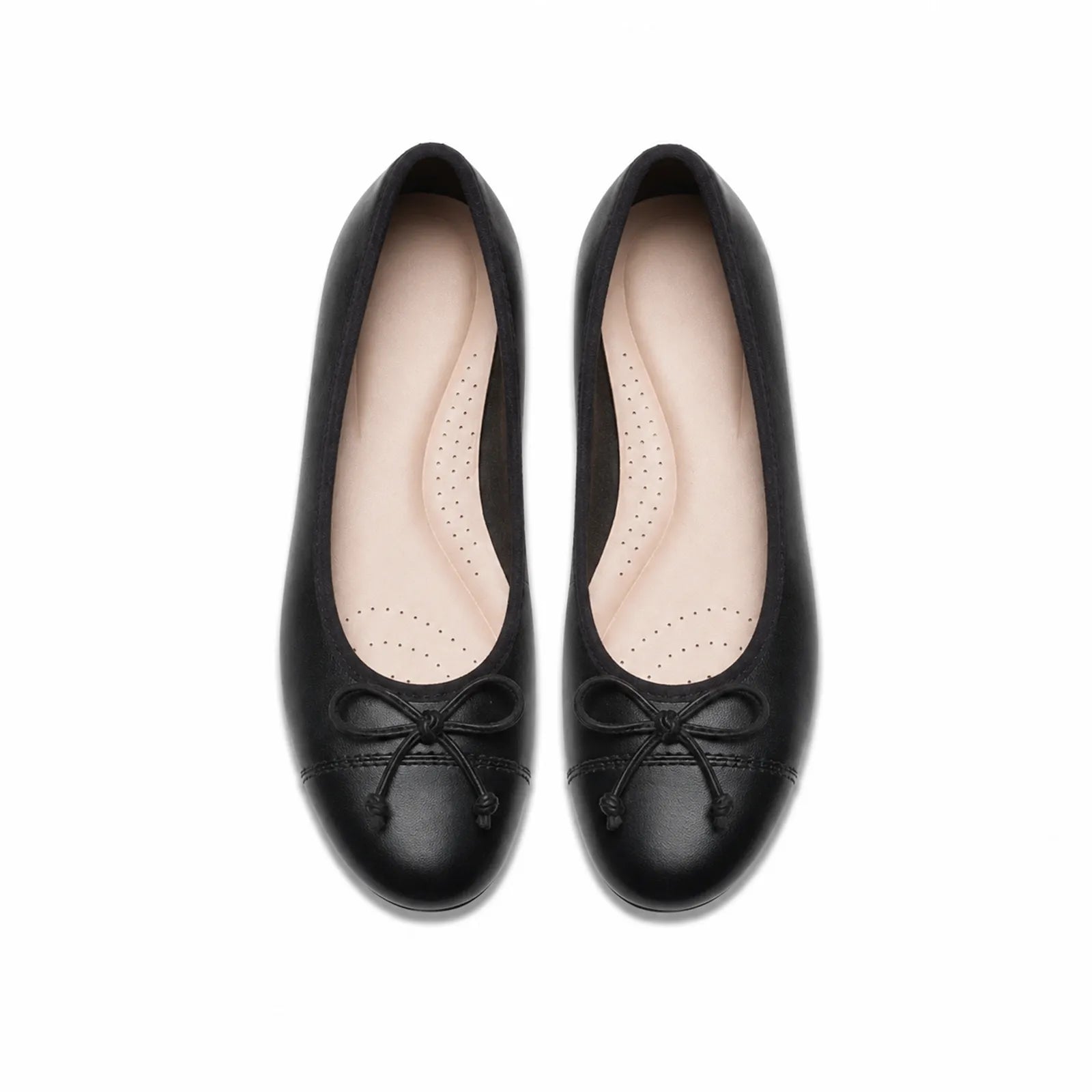 Women’s black leather flat loafers, top view with lace bow and perforated insole