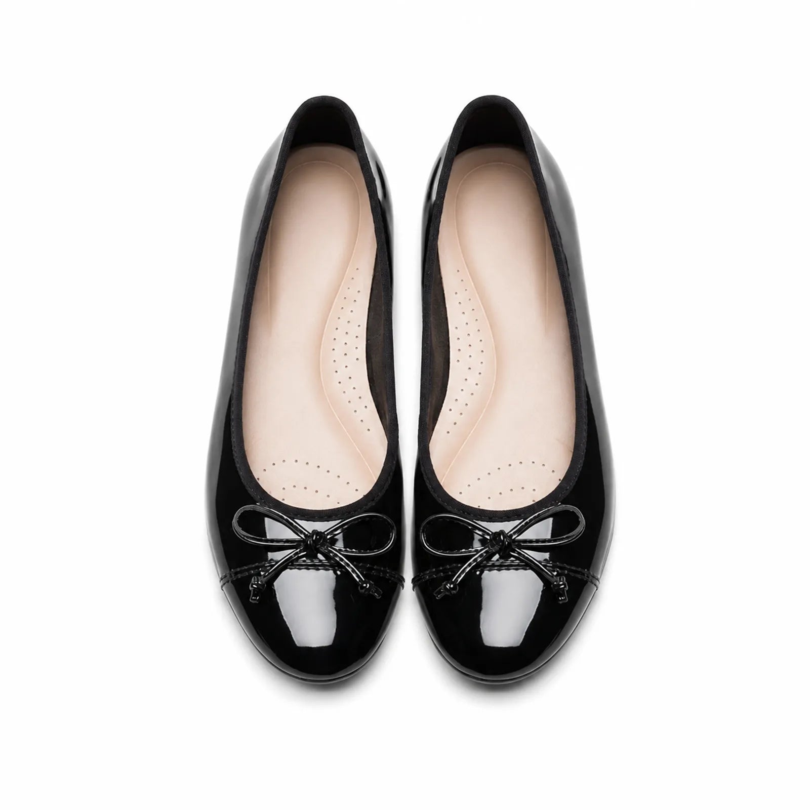 Women’s black patent leather flat loafers, top view with lace bow and perforated insole