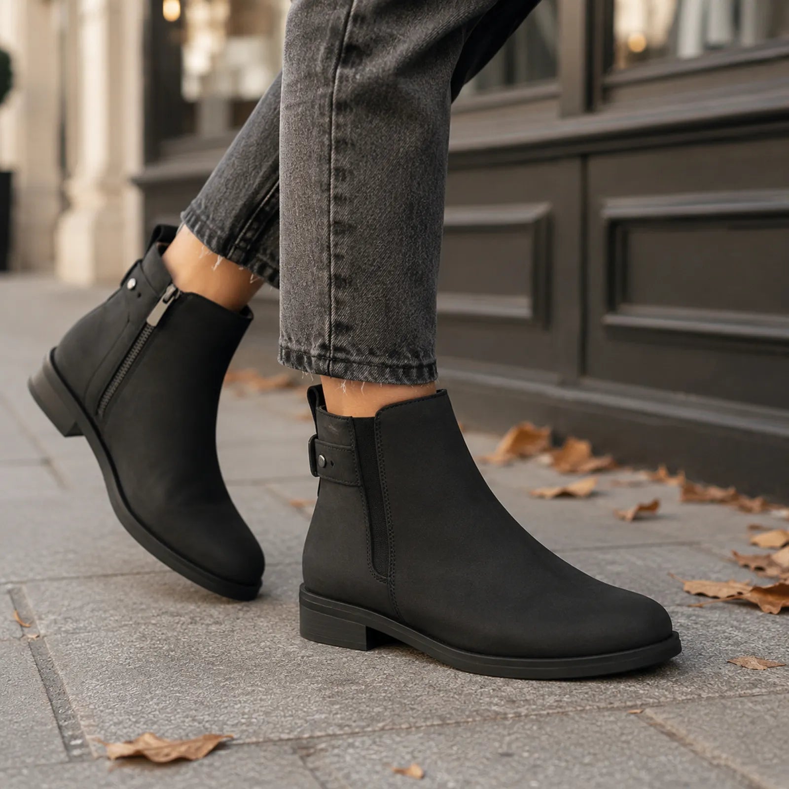 Black leather ankle boots with side zipper and low block sole