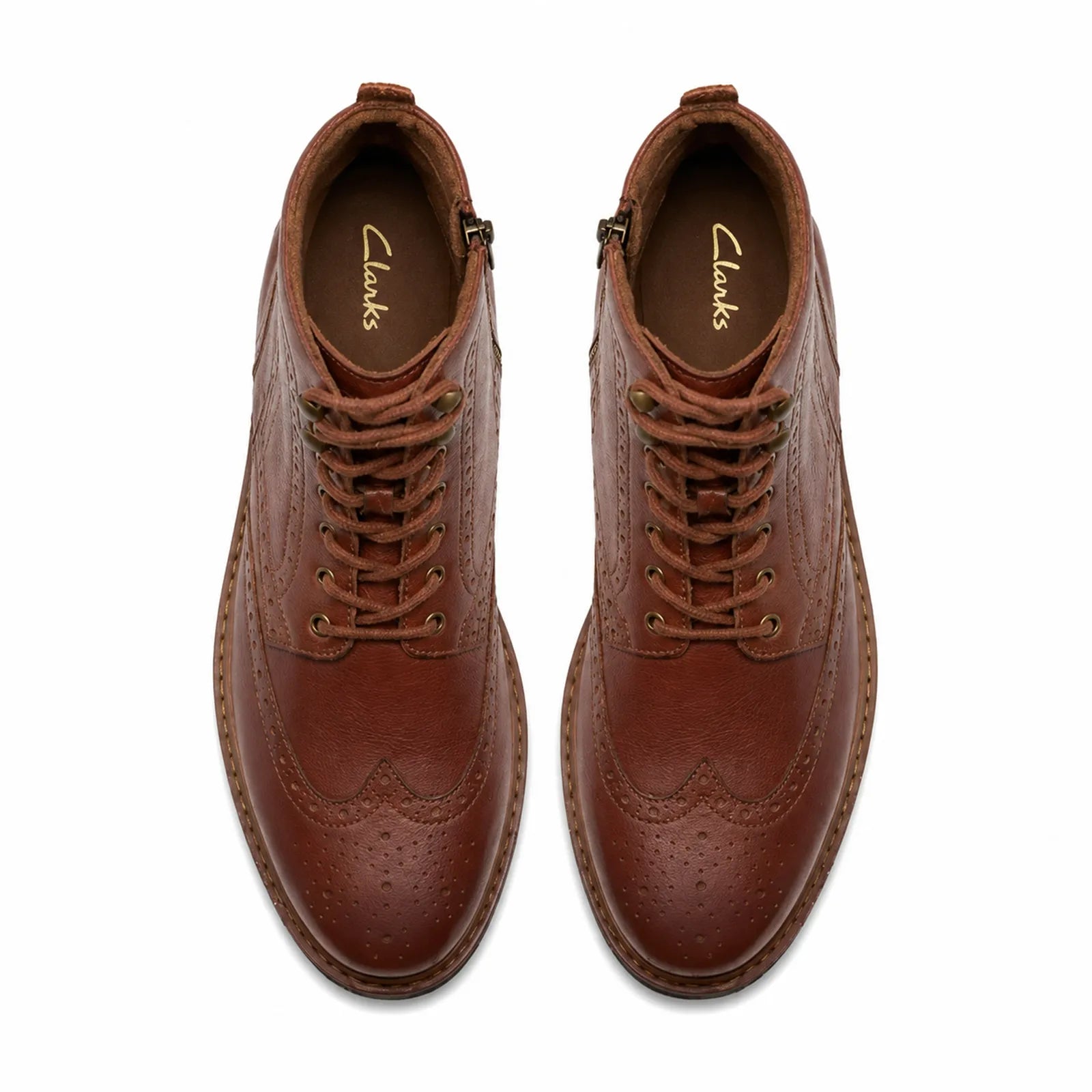 Pair of men's brown leather lace-up ankle boots with lace eyelets