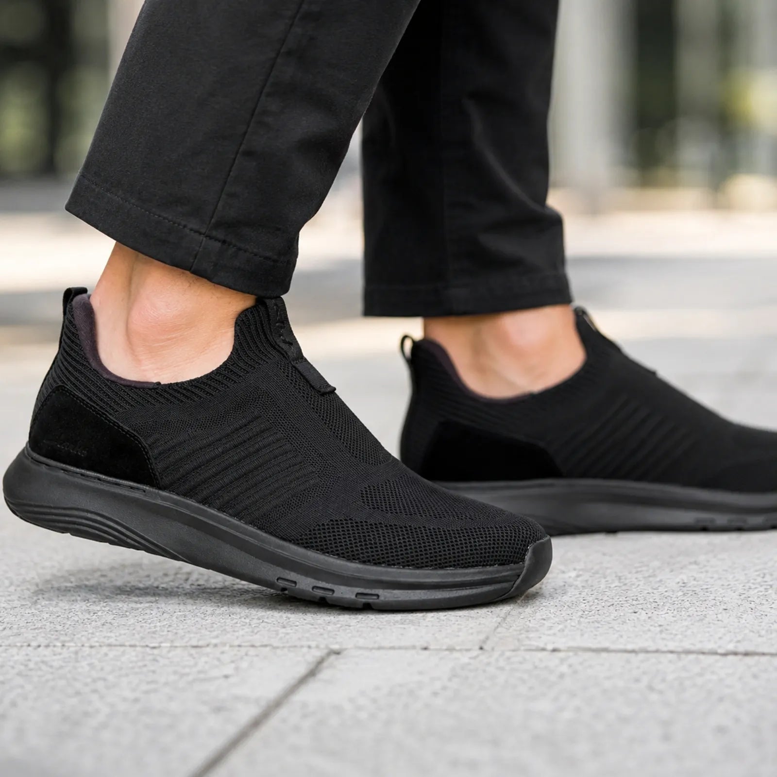Clarks Motion Trek IN black sneakers shown on foot for comfortable everyday walking
