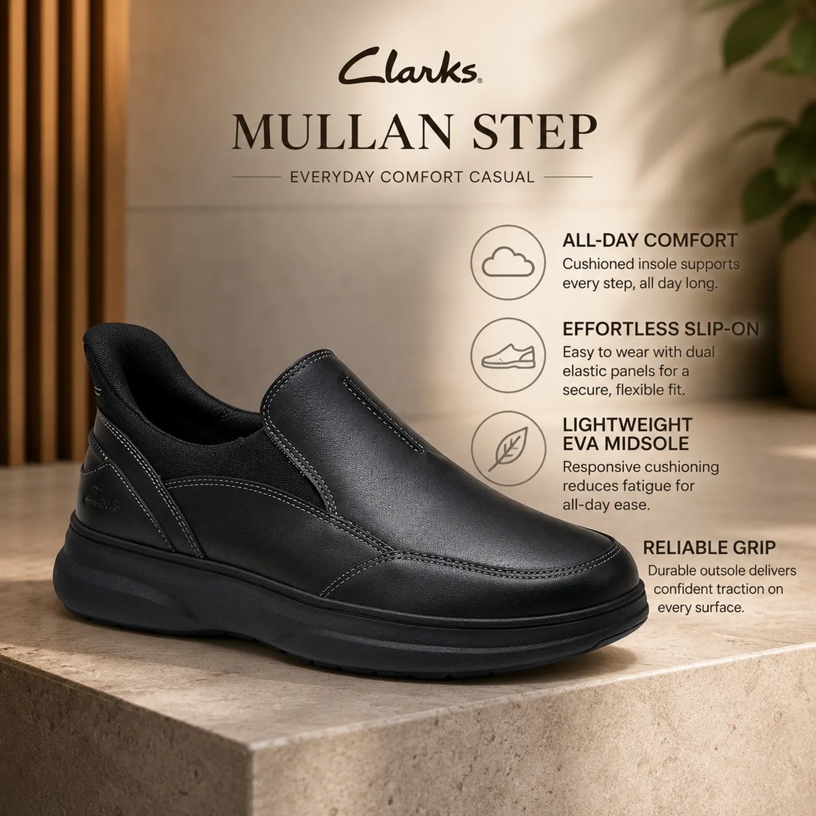 Black leather slip-on business shoe with elastic side panels and cushioned sole