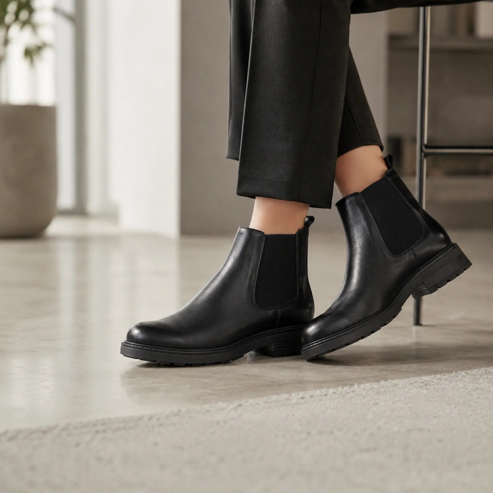 Women’s black leather Chelsea boots with elastic side gore and stacked rubber sole