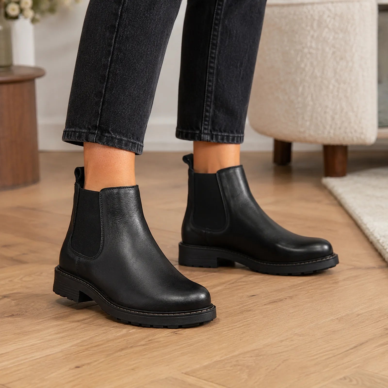 Women’s black leather ankle boots with elastic side gores and block heel sole