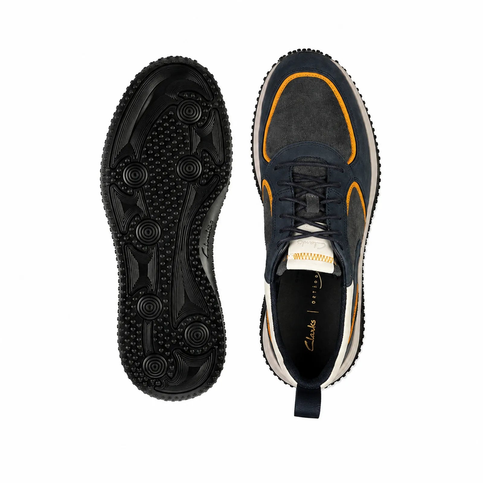 Pair of men's sneakers shown with soles down, navy color and orange trim detail
