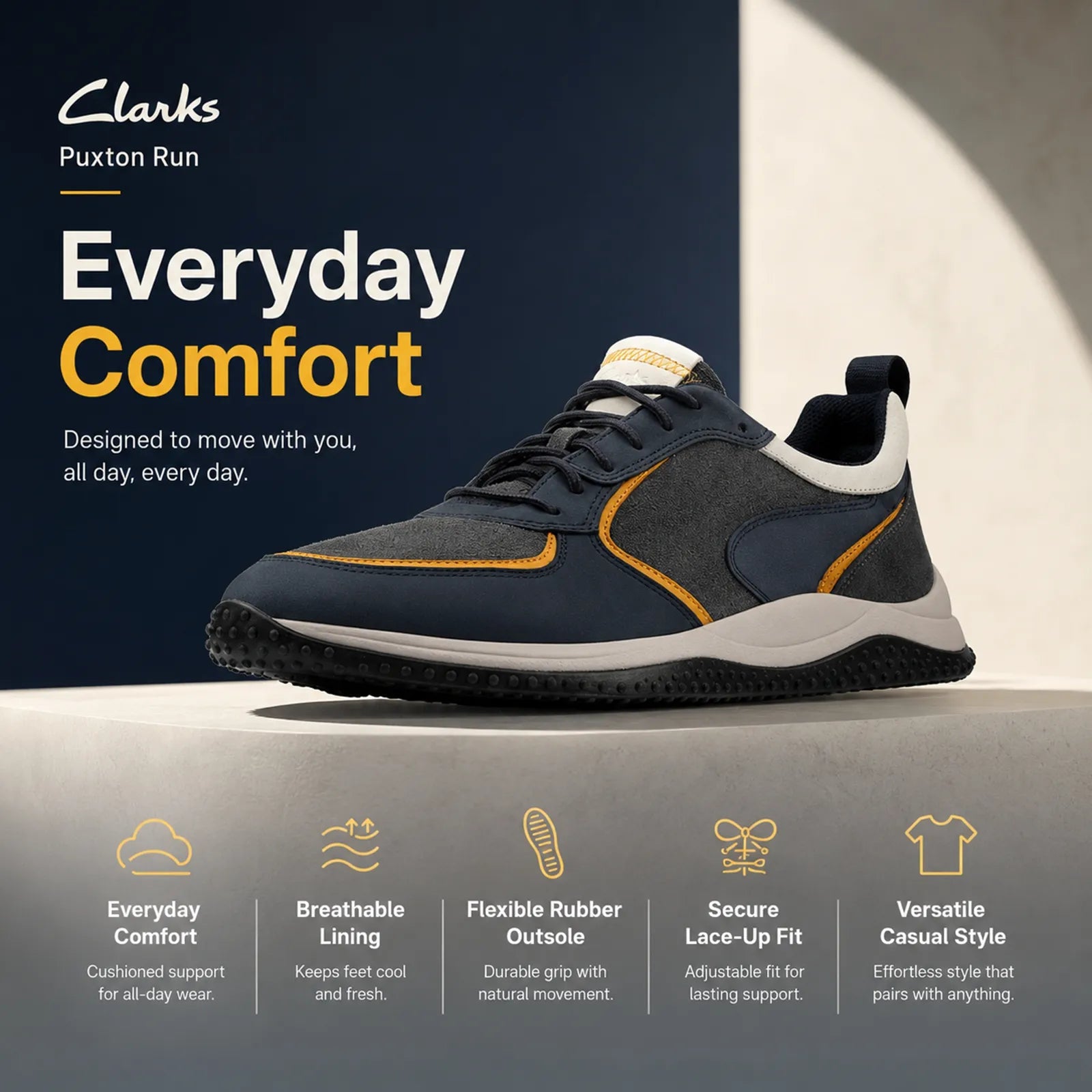 Men's lace-up casual sneakers with cushioned white sole, dark blue uppers and orange edges
