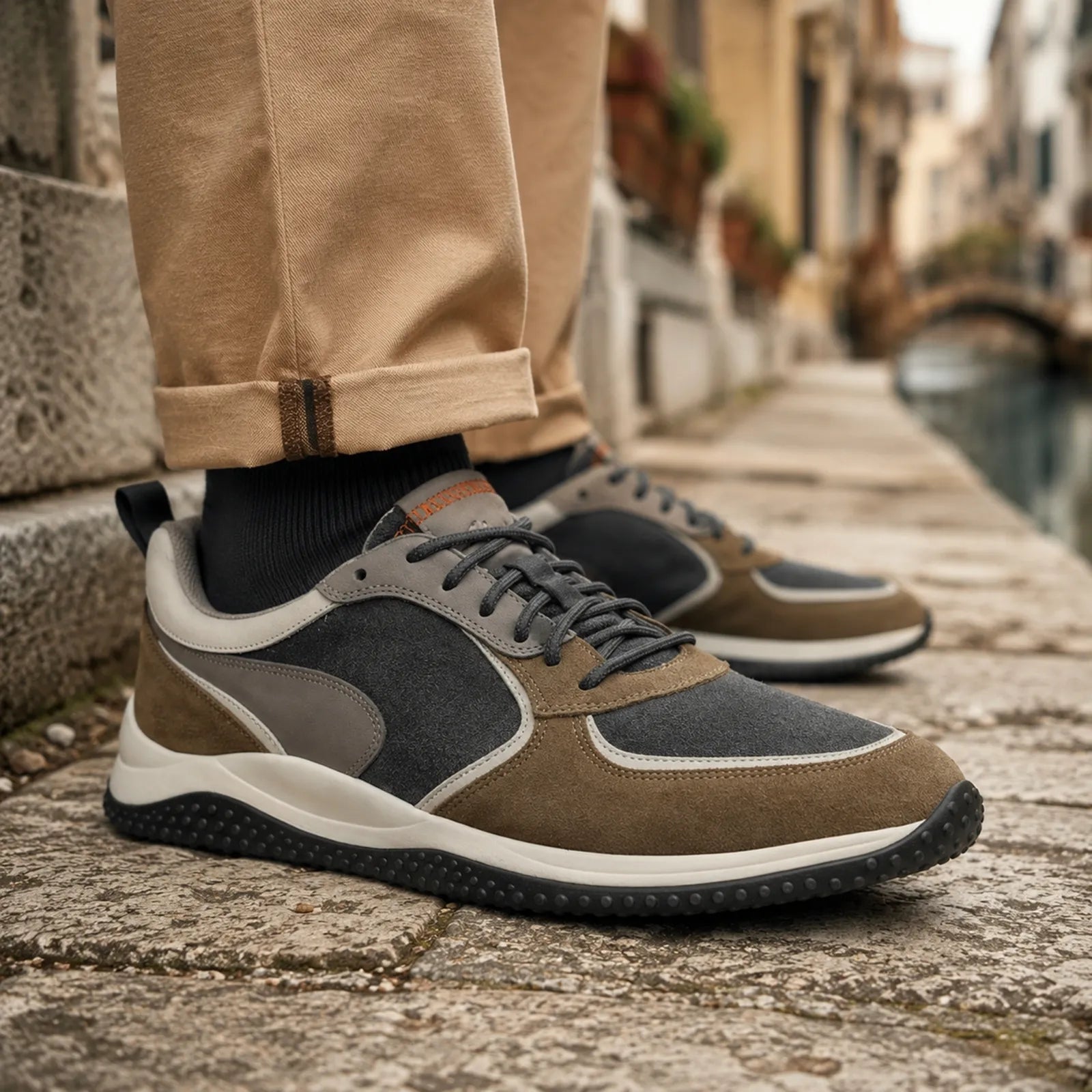 Men's lace-up sneakers close-up, brown nubuck with dark gray panels and rubber outsole