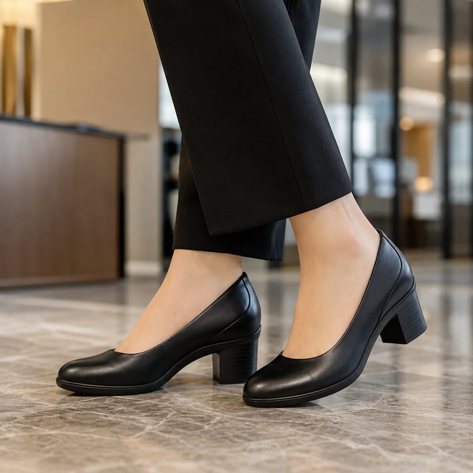 Clarks Shaya Poppy black leather court shoes shown on foot for office wear
