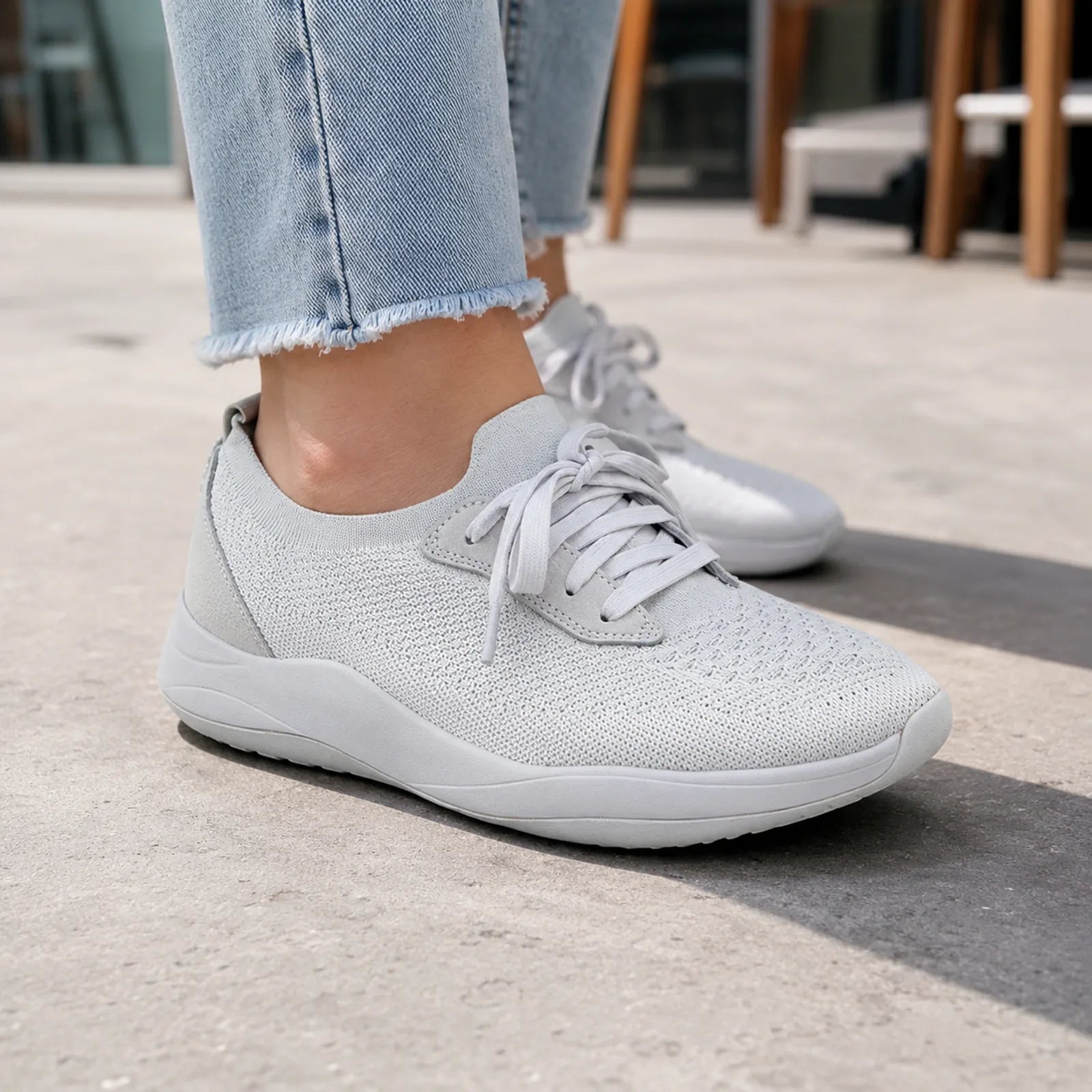Men's light gray knit sneakers with white laces and low-profile sole
