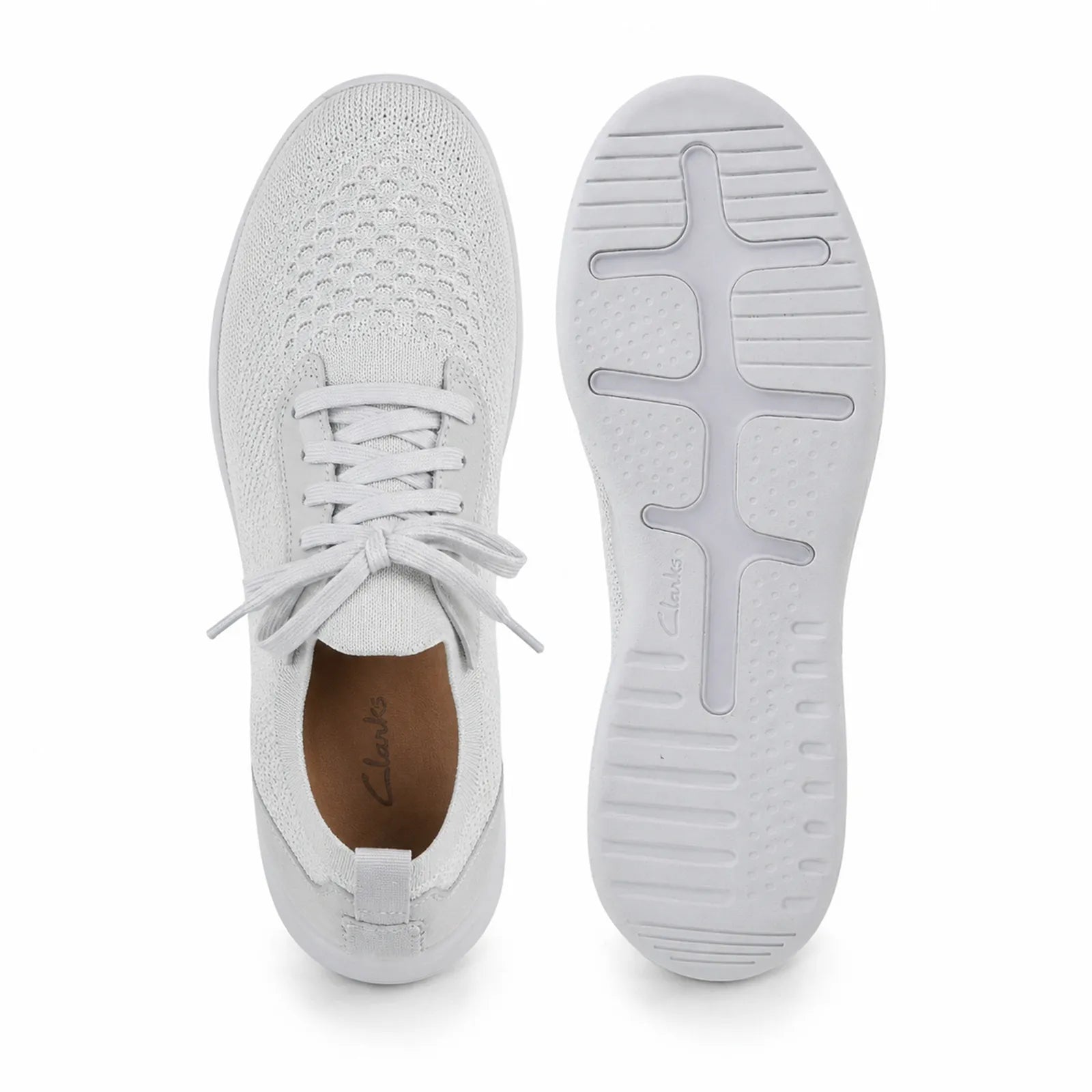 Pair of light gray sneakers showing lace-up uppers and grippy outsole