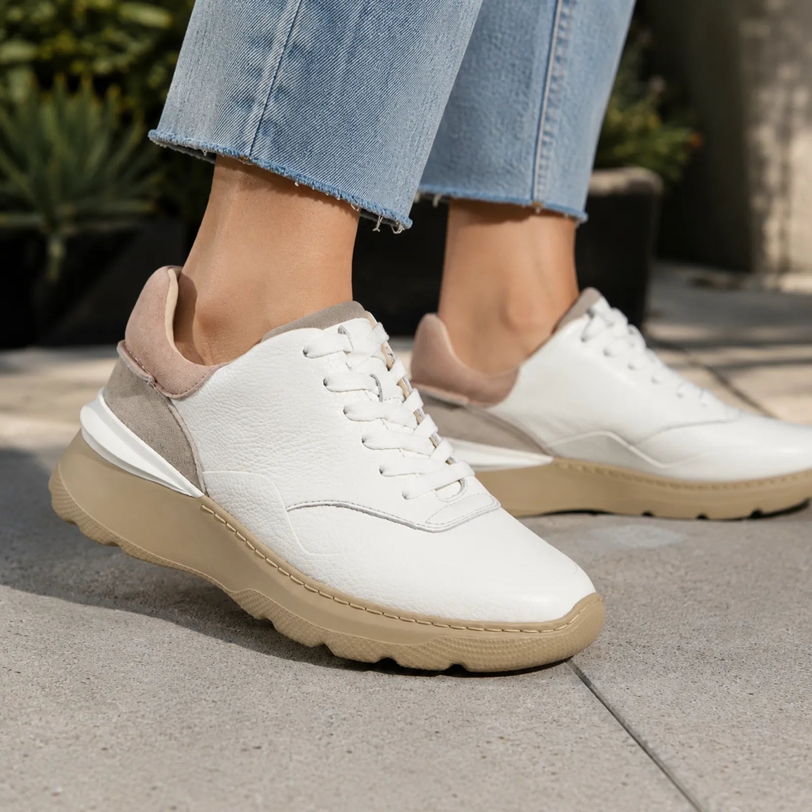 Women's white leather sneakers with beige-trim chunky sole and lace-up front