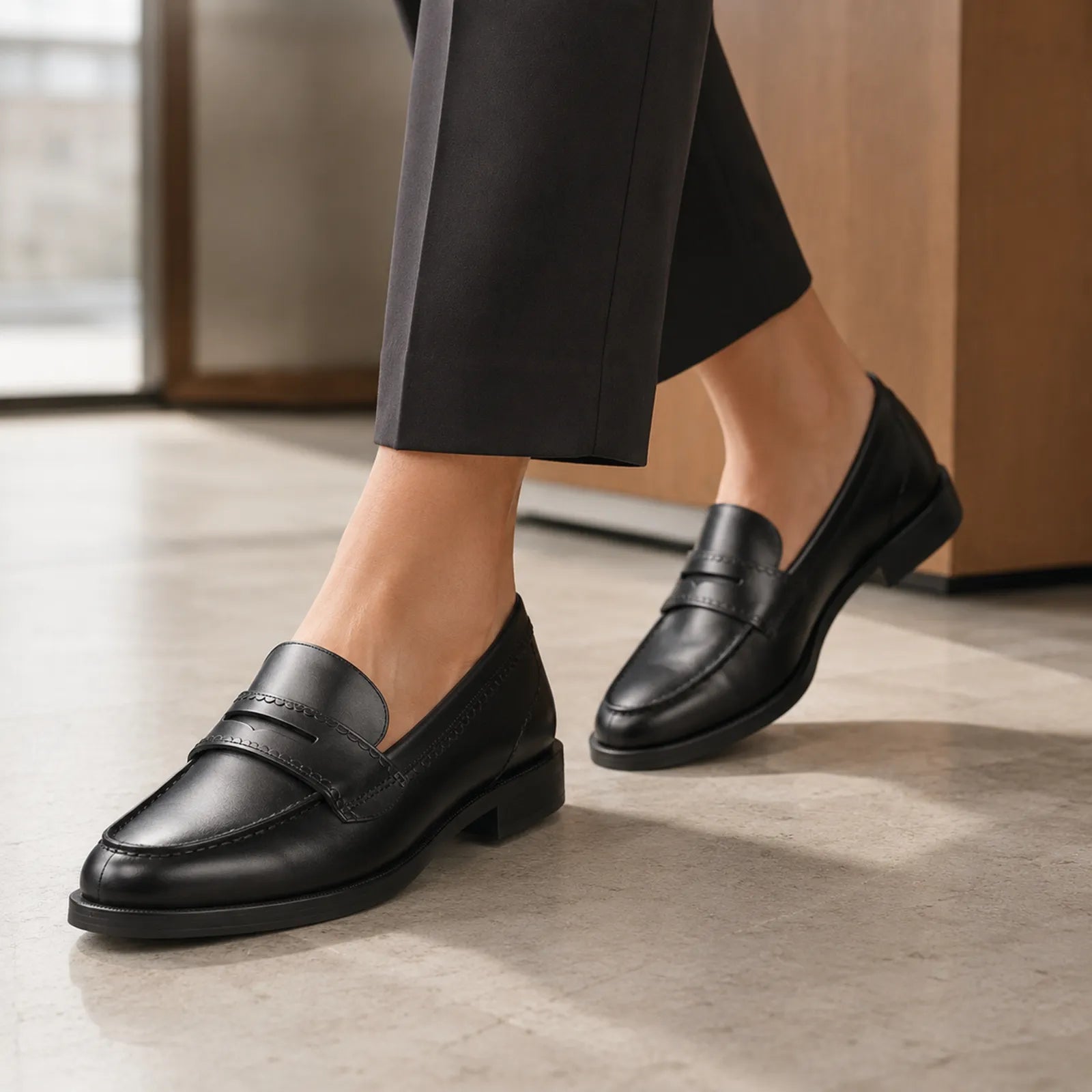 Women’s black leather slip-on loafer with low block heel