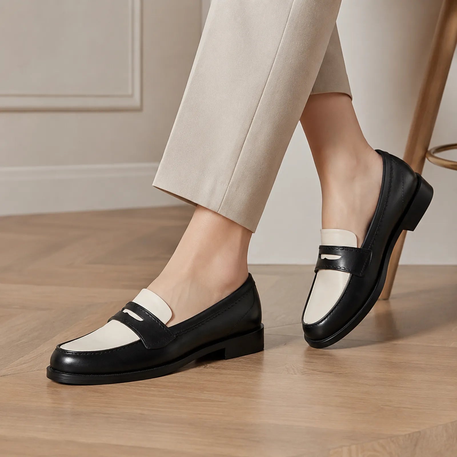 Women’s two-tone leather penny loafer with white vamp and black trim