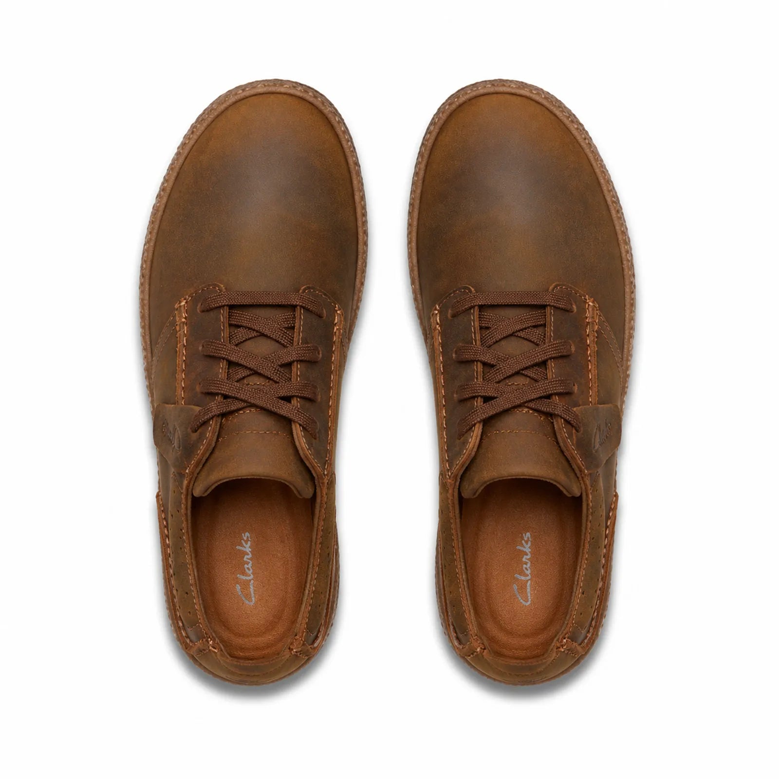 Pair of brown leather lace-up sneakers with padded tongue and rubber sole